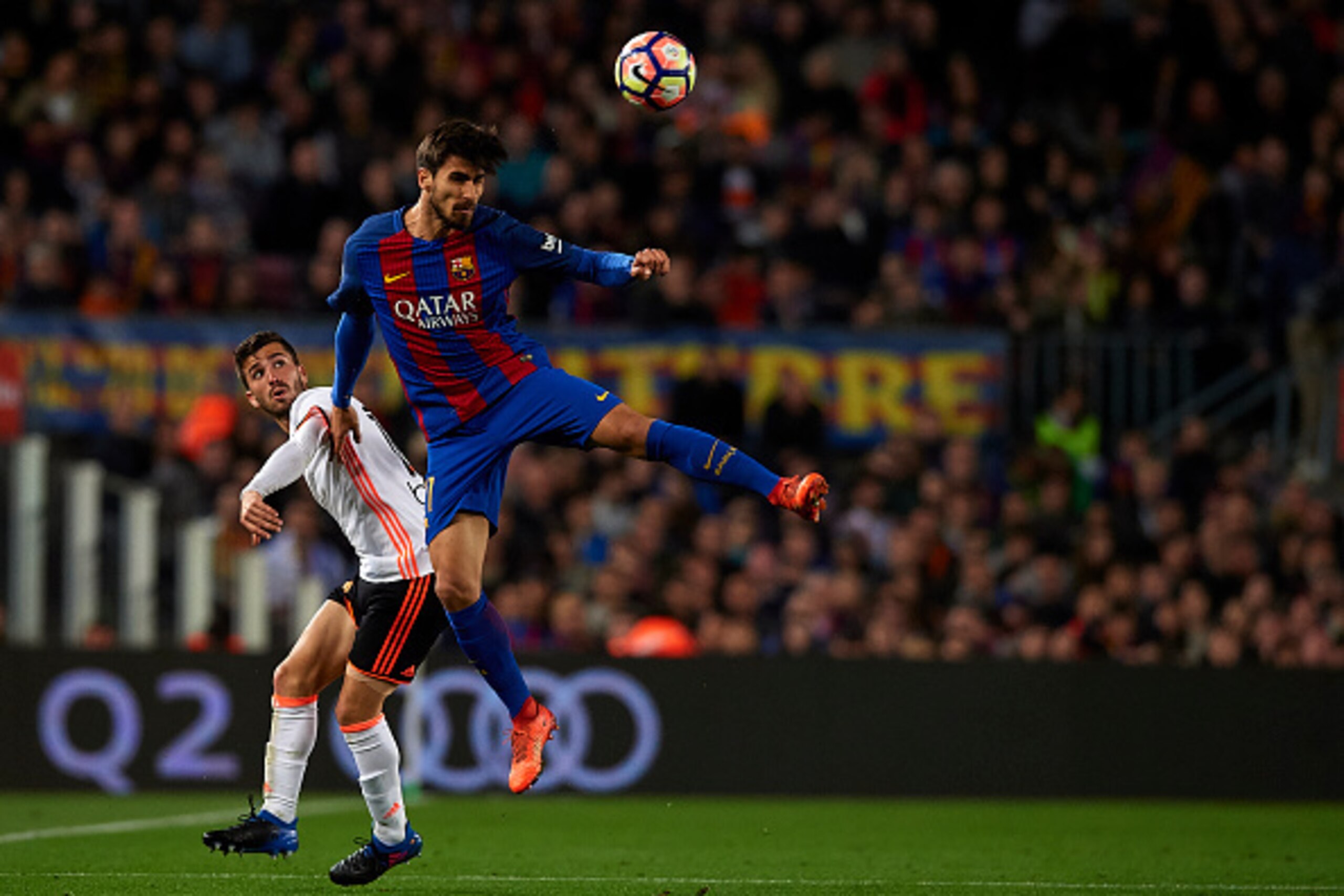BARCELONA, SPAIN - MARCH 19:  Andre Gomes (R) of Barcelona competes for the ball with Jose Luis Gaya of Valencia during the La Liga match between FC Barcelona and Valencia CF at Camp Nou Stadium on March 19, 2017 in Barcelona, Spain.  (Photo by Manuel Que