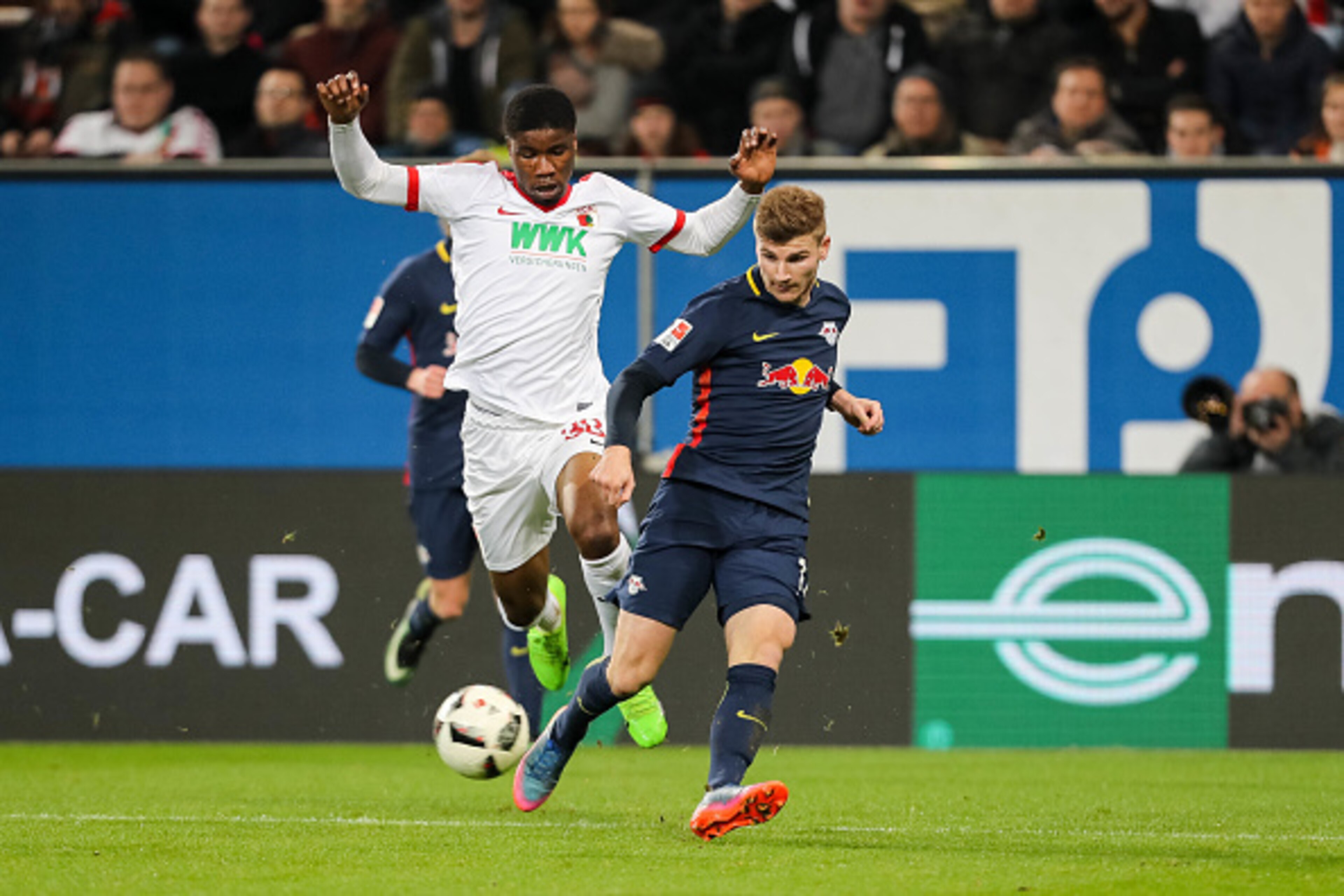 AUGSBURG, GERMANY - MARCH 03: Kevin Danso of Augsburg and Timo Werner of Leipzig battle for the ball during the Bundesliga match between FC Augsburg and RB Leipzig at WWK Arena on March 3, 2017 in Augsburg, Germany. (Photo by TF-Images/Getty Images)