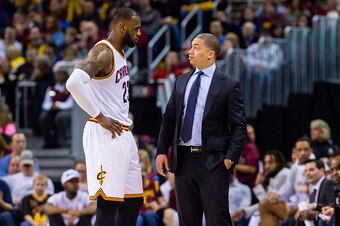 CLEVELAND, OH - FEBRUARY 11: LeBron James #23 talks with head coach Tyronn Lue of the Cleveland Cavaliers during the second half against the Denver Nuggets at Quicken Loans Arena on February 11, 2017 in Cleveland, Ohio. The Cavaliers defeated the Nuggets 