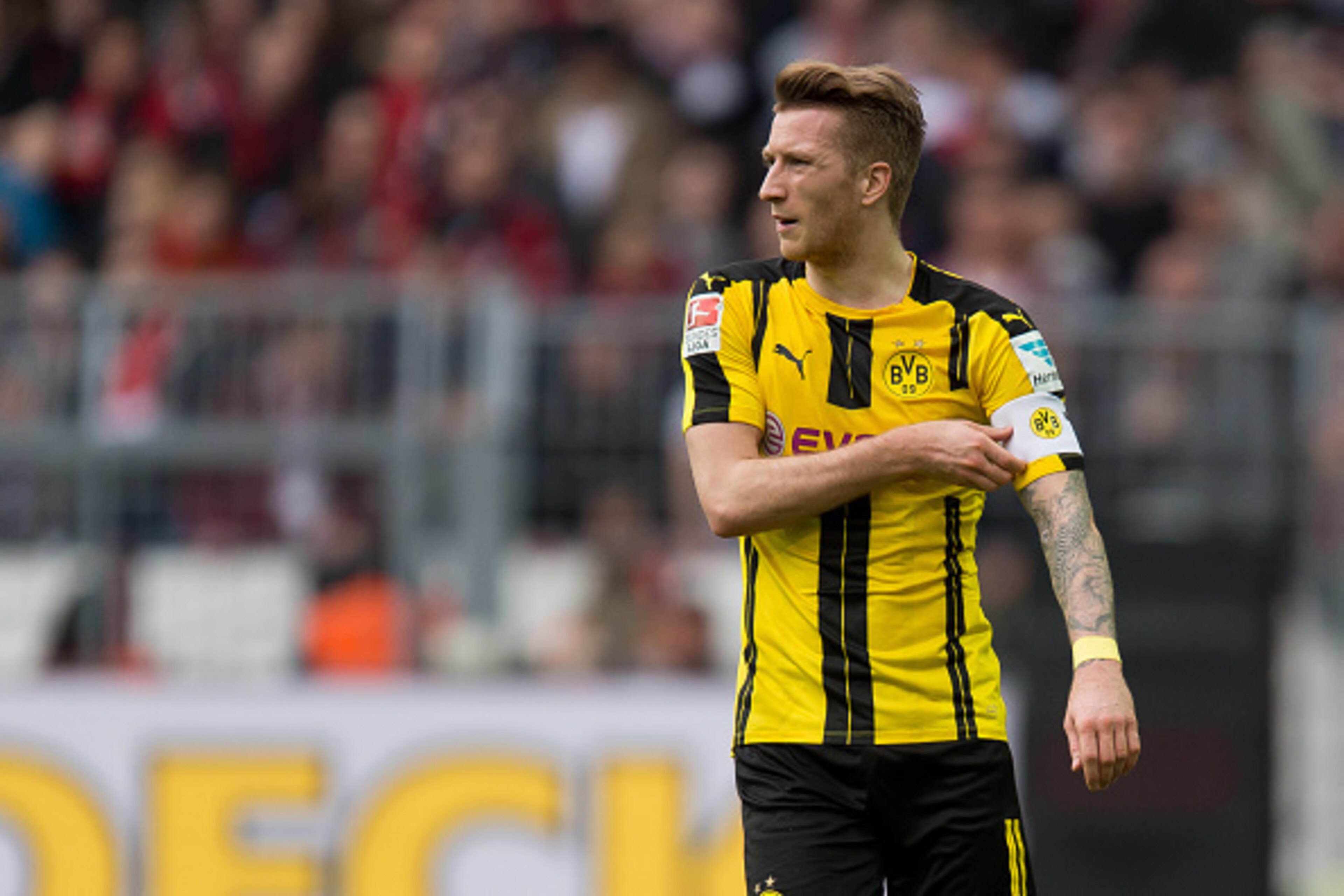 DORTMUND, GERMANY - MARCH 04: Marco Reus of Dortmund with Capita bond during the Bundesliga match between Borussia Dortmund and Bayer 04 Leverkusen at Signal Iduna Park on March 4, 2017 in Dortmund, Germany. (Photo by TF-Images/Getty Images) DORTMUND, GERMANY - MARCH 04: Marco Reus of Dortmund with Capita bond during the Bundesliga match between Borussia Dortmund and Bayer 04 Leverkusen at Signal Iduna Park on March 4, 2017 in Dortmund, Germany. (Photo by TF-Images/Getty Images)
