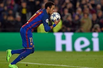 Barcelona's Brazilian forward Neymar runs with the ball after scoring a goal during the UEFA Champions League round of 16 second leg football match FC Barcelona vs Paris Saint-Germain FC at the Camp Nou stadium in Barcelona on March 8, 2017. / AFP PHOTO /