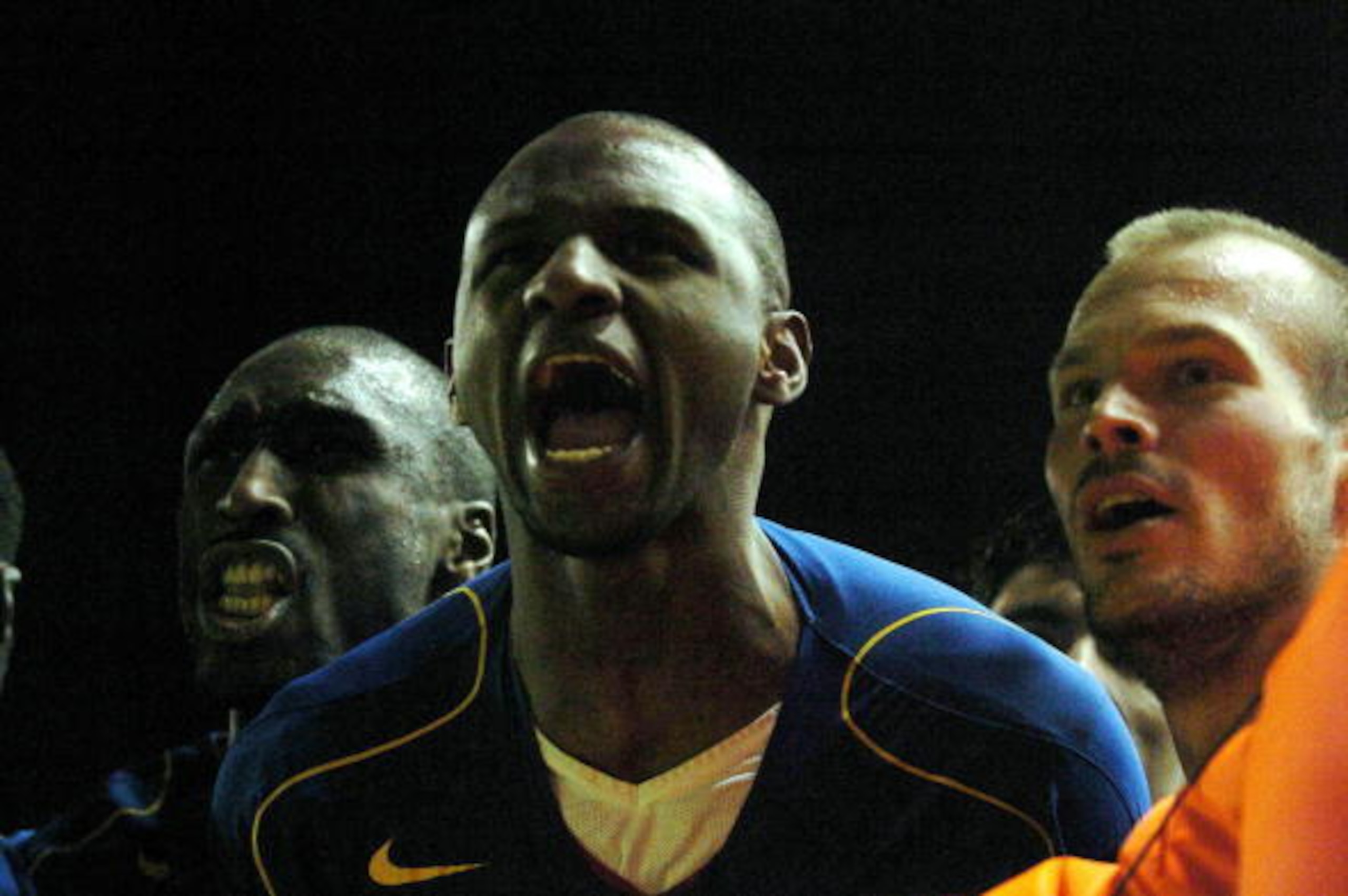 LIVERPOOL, UNITED KINGDOM:  Arsenal's Patrick Vieira (C) celebrates with Sol Campbell (L) and Fredrik Ljungberg (R) after scoring against Liverpool during their football match in Anfield, Liverpool, 28 November 2004.    AFP PHOTO/PAUL BARKER       (Photo 