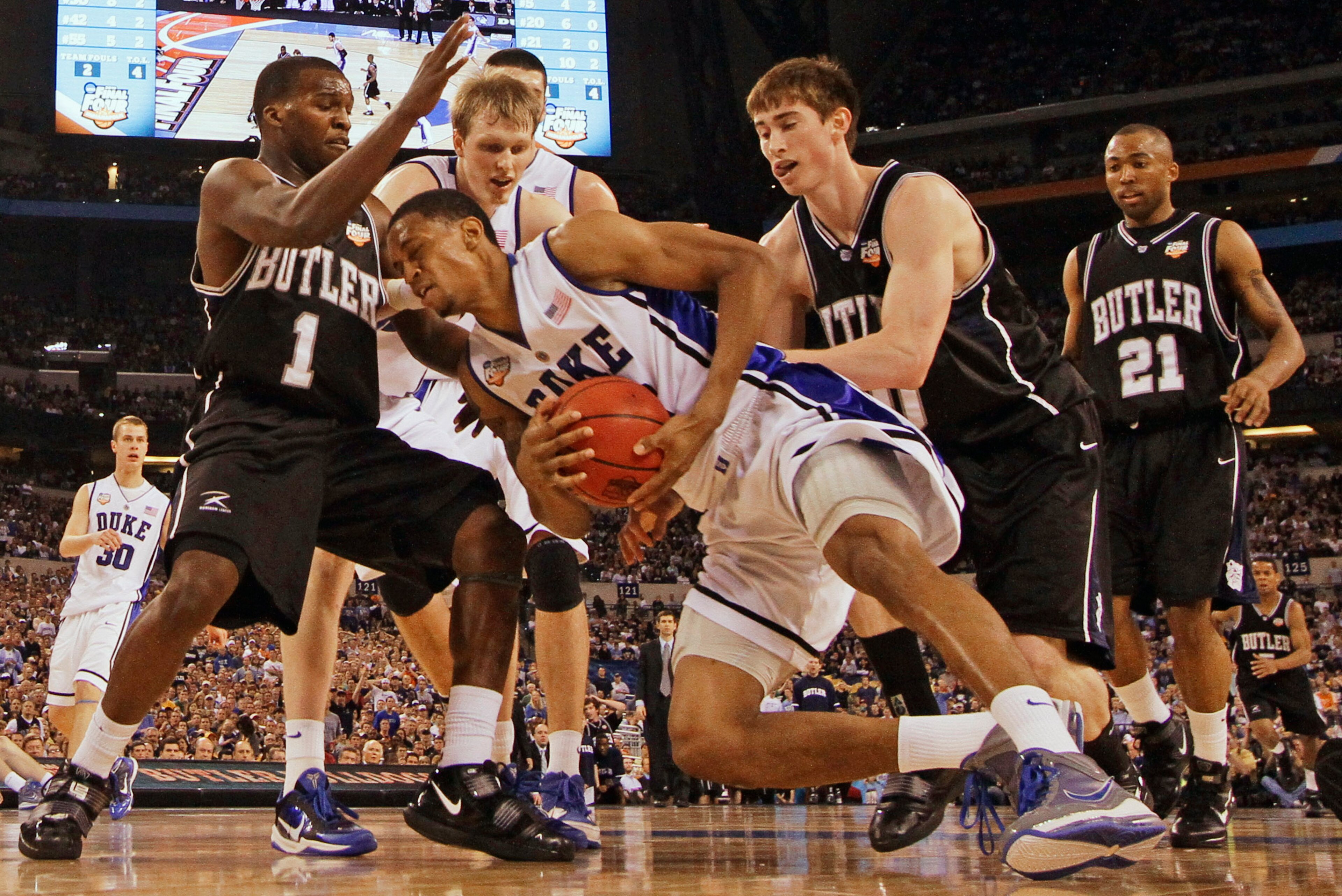 Duke's Lance Thomas is double-teamed by Butler's Shelvin Mack (1) and Gordon Hayward during the second half of the men's NCAA championship game on April 5, 2010, in Indianapolis.