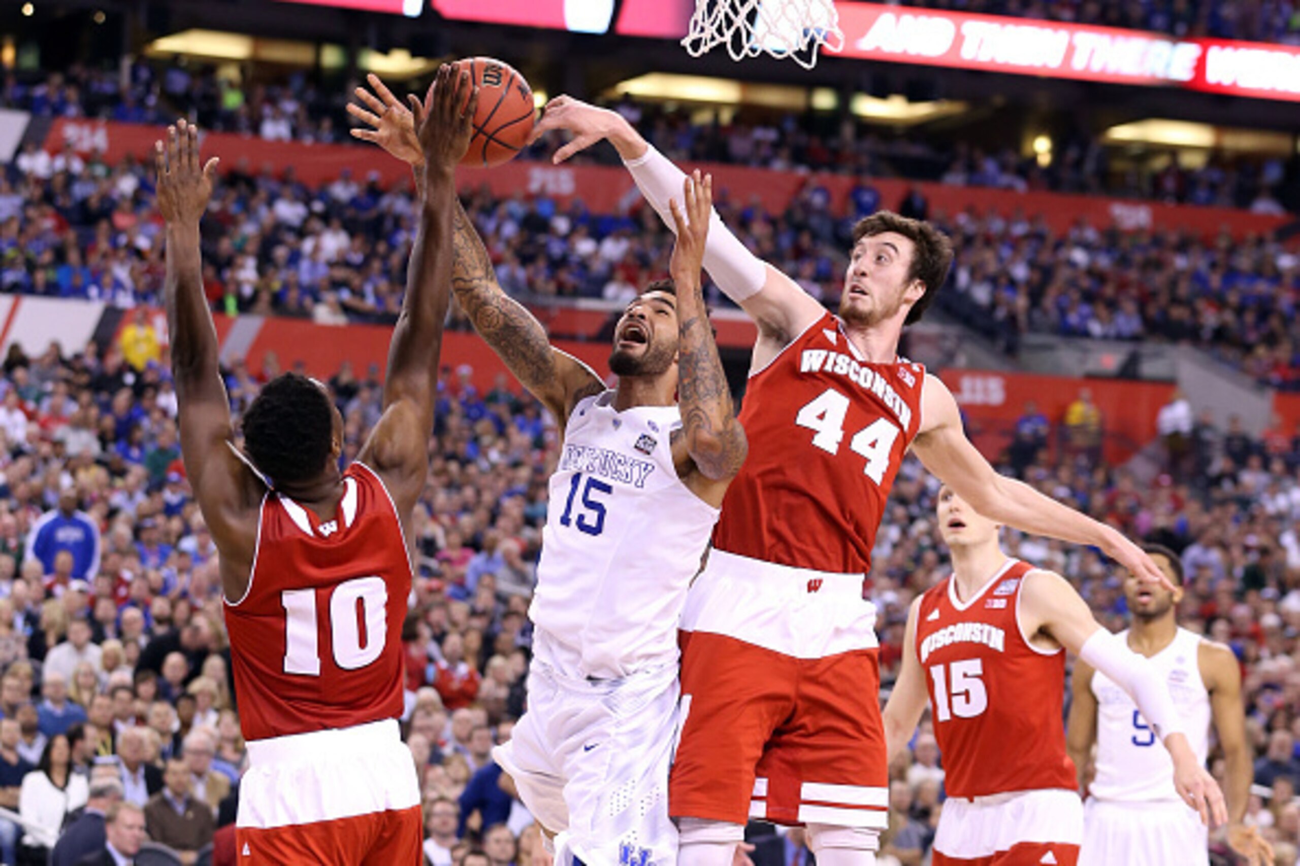 INDIANAPOLIS, IN - APRIL 04: Willie Cauley-Stein #15 of the Kentucky Wildcats goes up with the ball against Nigel Hayes #10 and Frank Kaminsky #44 of the Wisconsin Badgers in the second half during the NCAA Men's Final Four Semifinal at Lucas Oil Stadium 