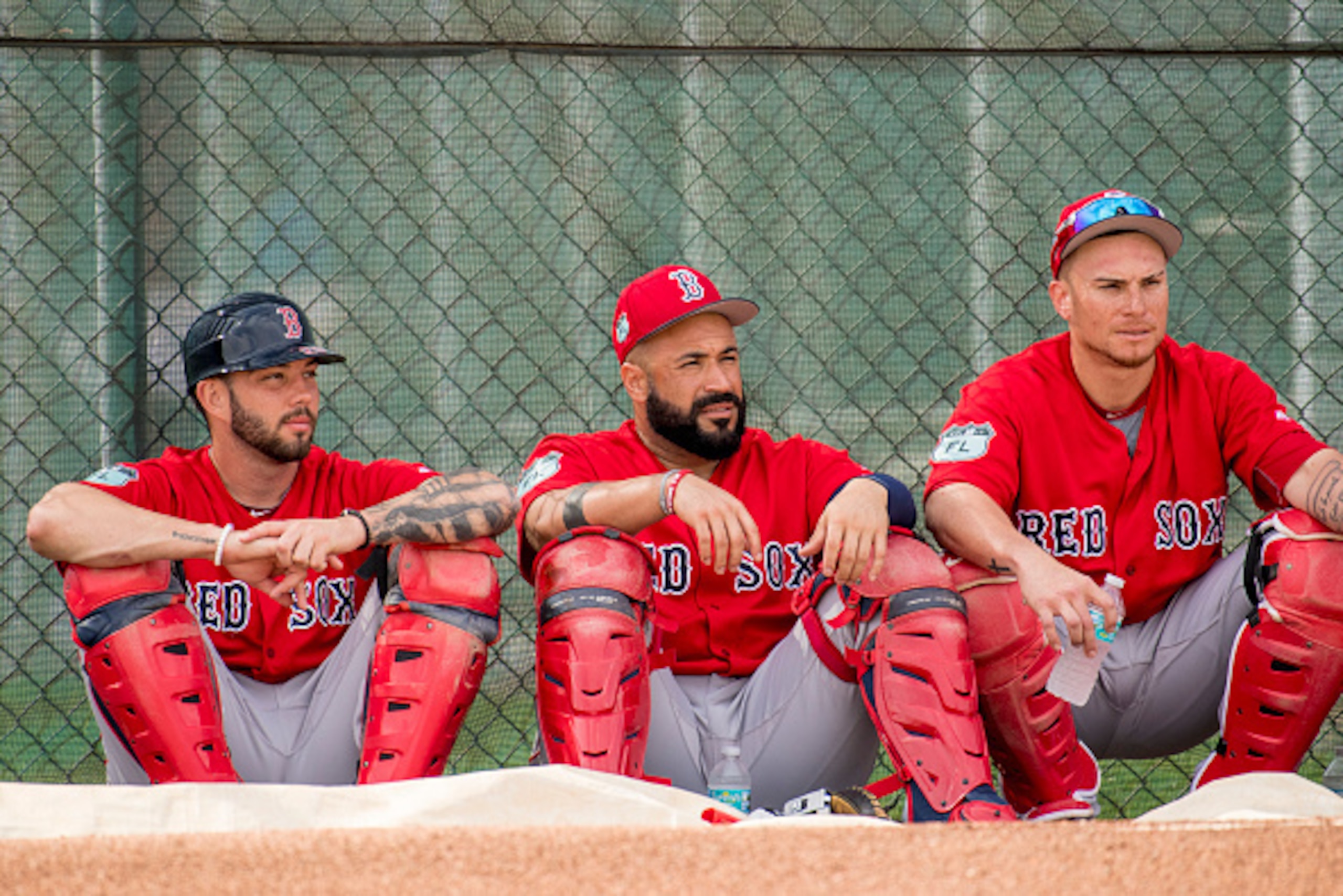 FT. MYERS, FL - FEBRUARY 21: Blake Swihart #23, Sandy Leon #3, and Christian Vazquez #7 of the Boston Red Sox look on during a team workout on February 21, 2017 at Fenway South in Fort Myers, Florida . (Photo by Billie Weiss/Boston Red Sox/Getty Images)