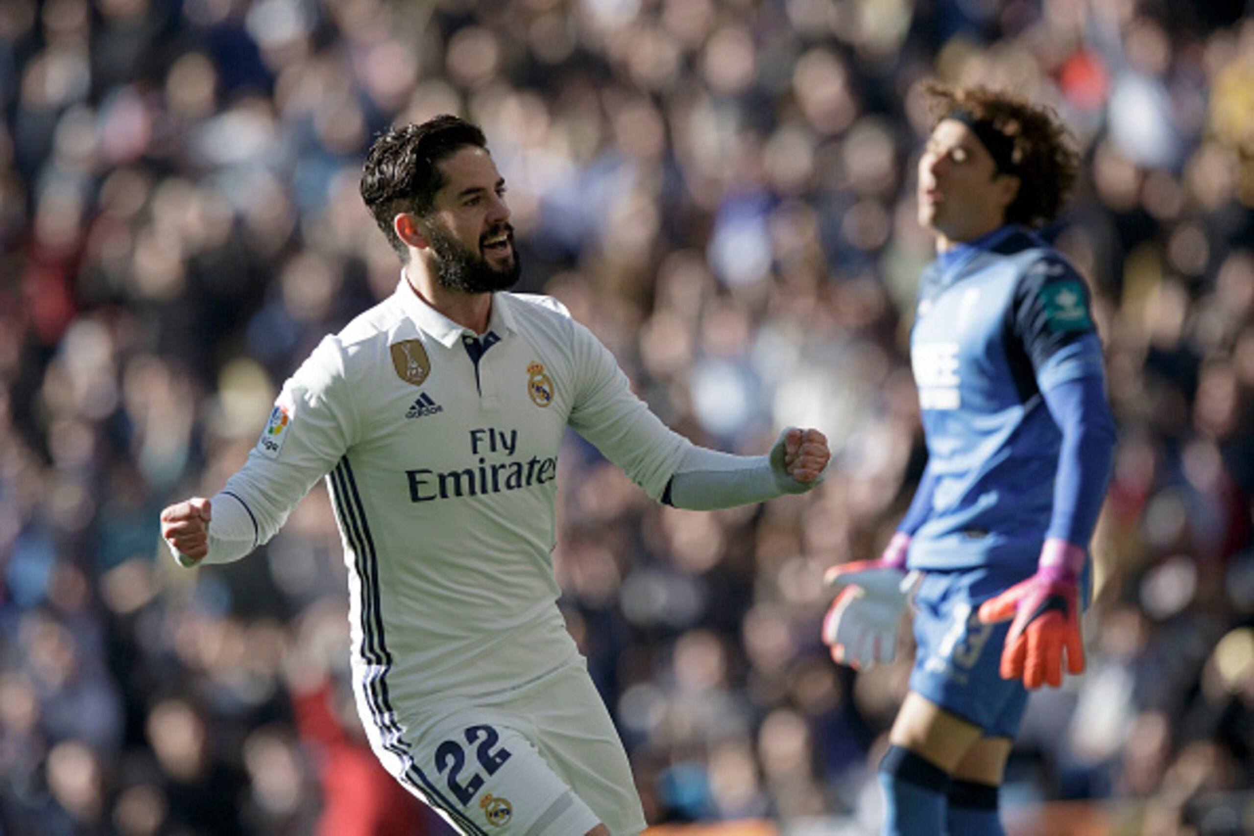 MADRID, SPAIN - JANUARY 07: Francisco Roman Alarcon alias Isco of Real Madrid CF celebrates scoring their opening goal during the La Liga match between Real Madrid CF and Granada CF at Estadio Santiago Bernabeu on January 7, 2017 in Madrid, Spain.  (Photo
