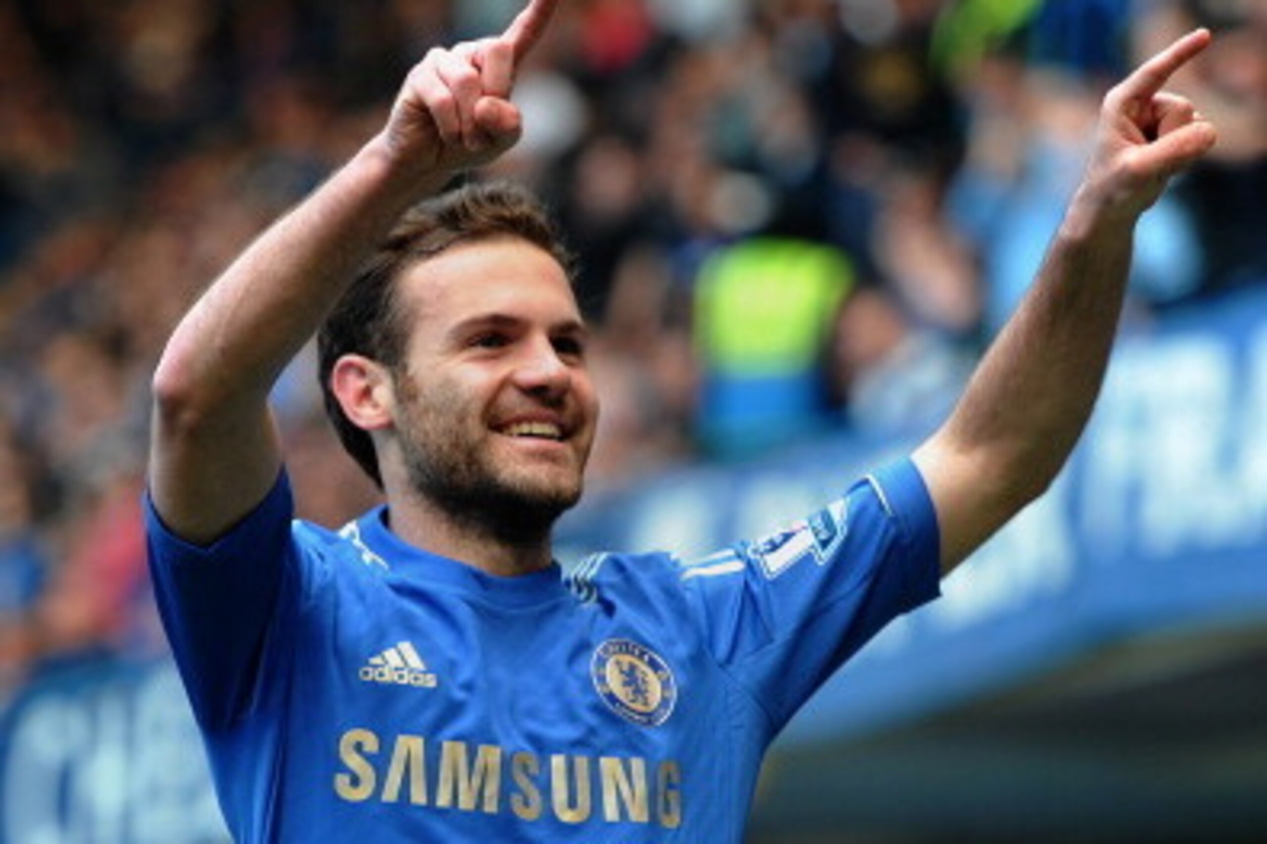 Chelsea's Spanish midfielder Juan Mata celebrates after scoring the opening goal during the English Premier League football match between Chelsea and Everton at Stamford Bridge in London on May 19, 2013.  AFP PHOTO / CARL COURT

RESTRICTED TO EDITORIAL US