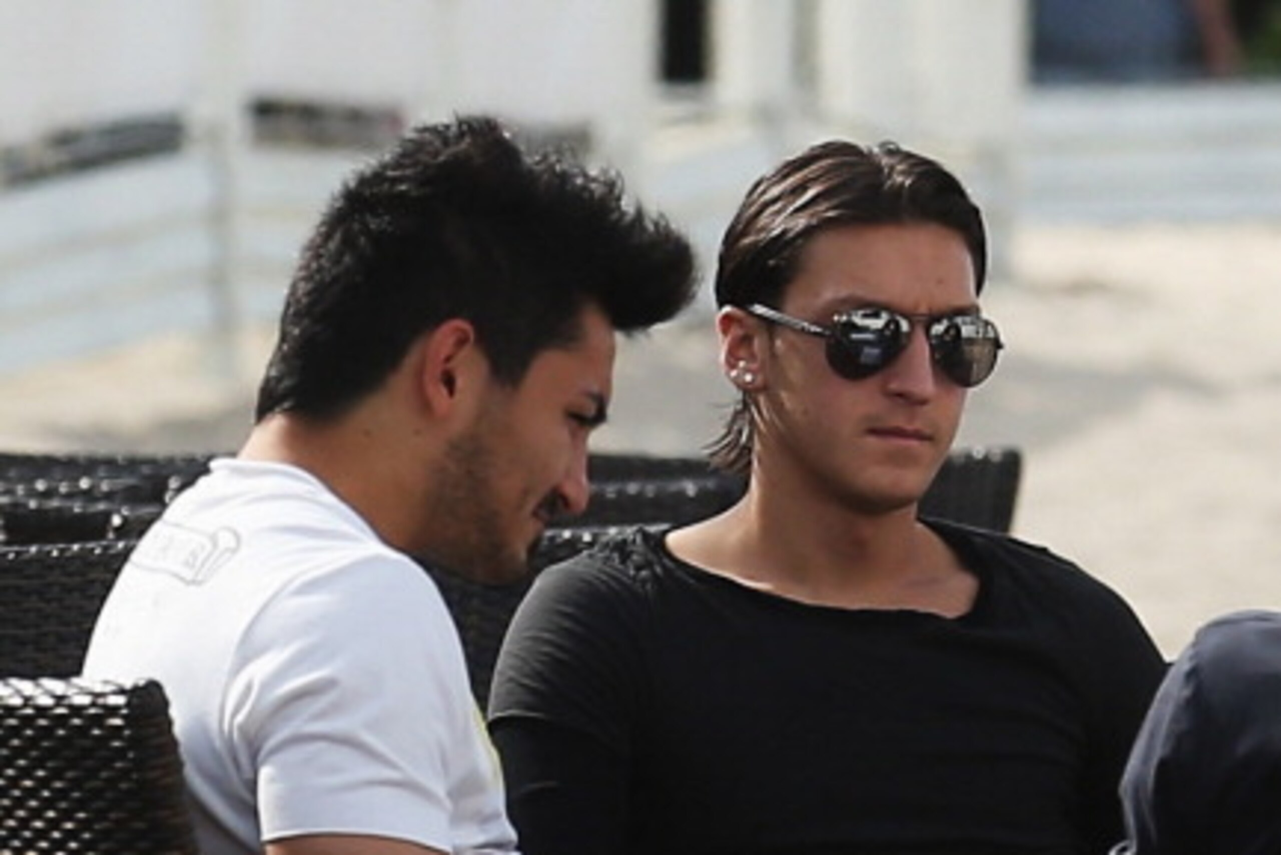 SOPOT, POLAND - JUNE 19: Ilkay Guendogan (L) and Mesut Oezil of the German national team are sighted in a beachbar at the beach on June 19, 2012 in Sopot, Poland.  (Photo by Joern Pollex/Getty Images)