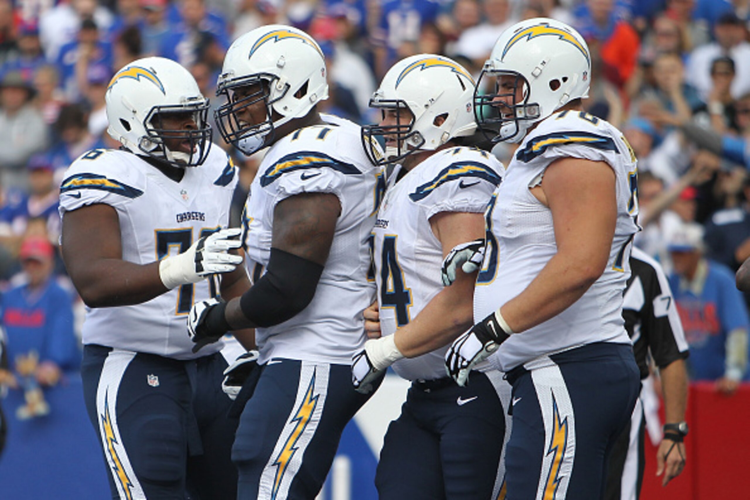 ORCHARD PARK, NY - SEPTEMBER 21: D.J. Fluker #76 of the San Diego Chargers, King Dunlap #77 of the San Diego Chargers, Rich Ohrnberger #74 of the San Diego Chargers and Chad Rinehart #78 of the San Diego Chargers celebrate after the touchdown against the 