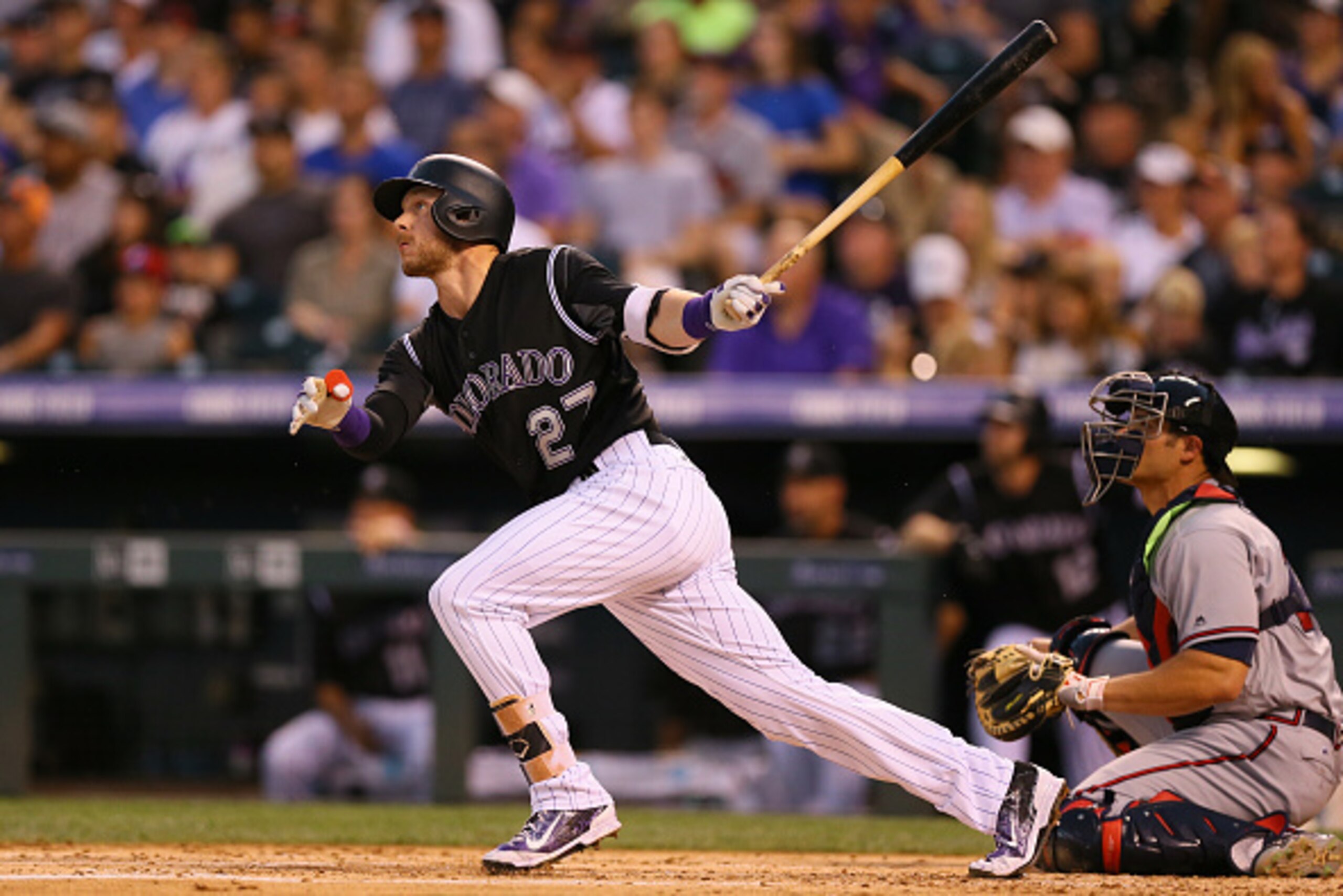 DENVER, CO - JULY 23: Trevor Story #27 of the Colorado Rockies watches his two run home run during the second inning as catcher Anthony Recker #20 of the Atlanta Braves looks on at Coors Field on July 23, 2016 in Denver, Colorado. (Photo by Justin Edmond DENVER, CO - JULY 23: Trevor Story #27 of the Colorado Rockies watches his two run home run during the second inning as catcher Anthony Recker #20 of the Atlanta Braves looks on at Coors Field on July 23, 2016 in Denver, Colorado. (Photo by Justin Edmond