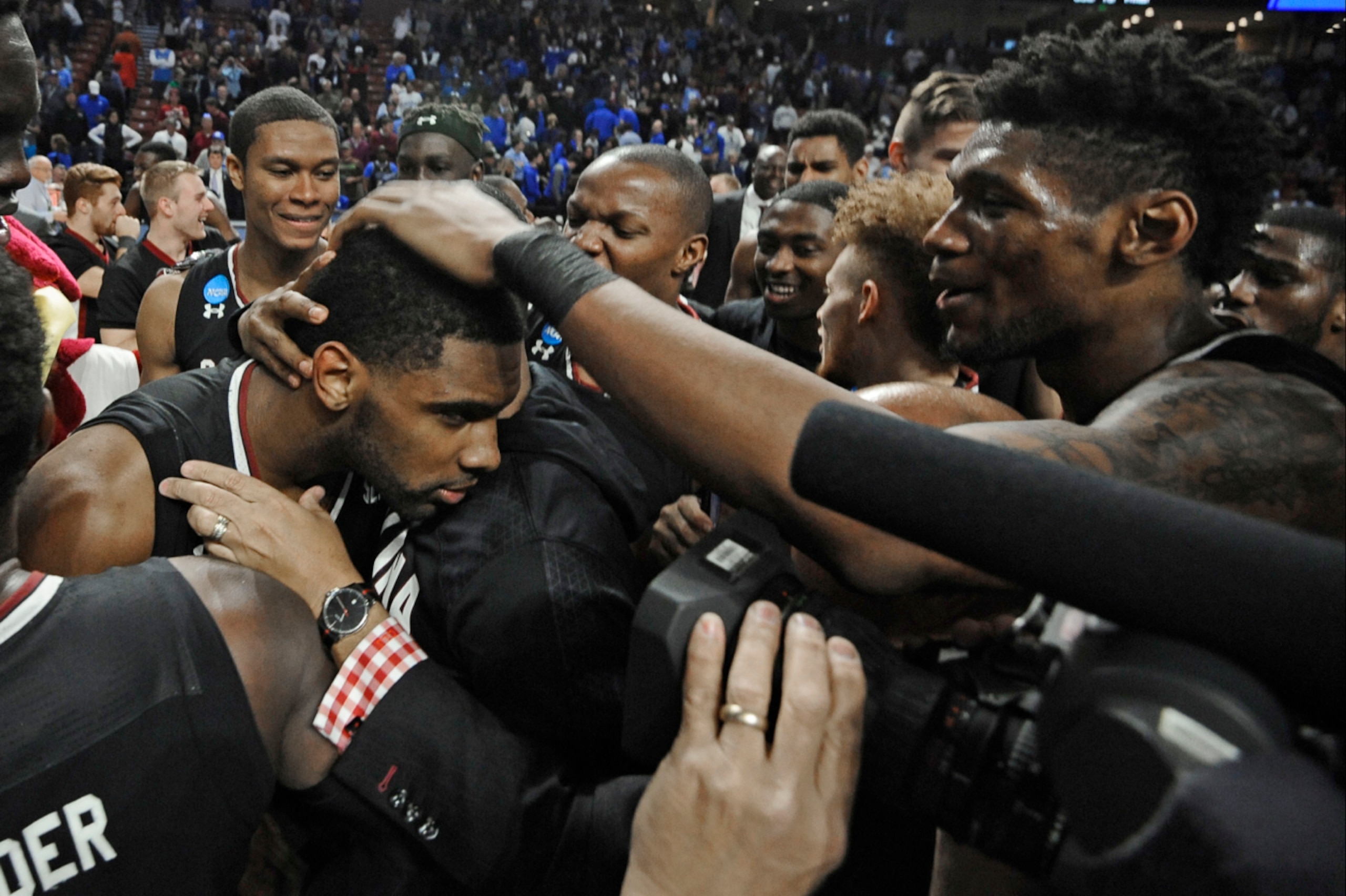 Thornwell (left) celebrates with teammates after beating Duke in the NCAA tournament on March 19, 2017.