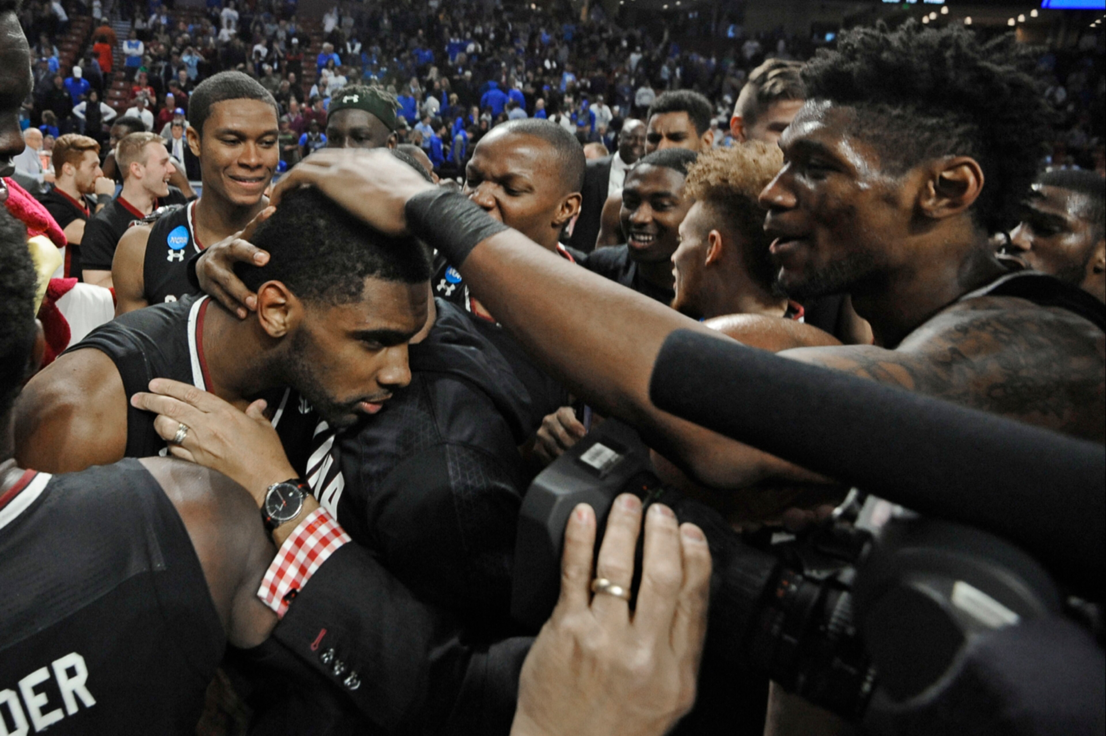 Thornwell (left) celebrates with teammates after beating Duke in the NCAA tournament on March 19, 2017.