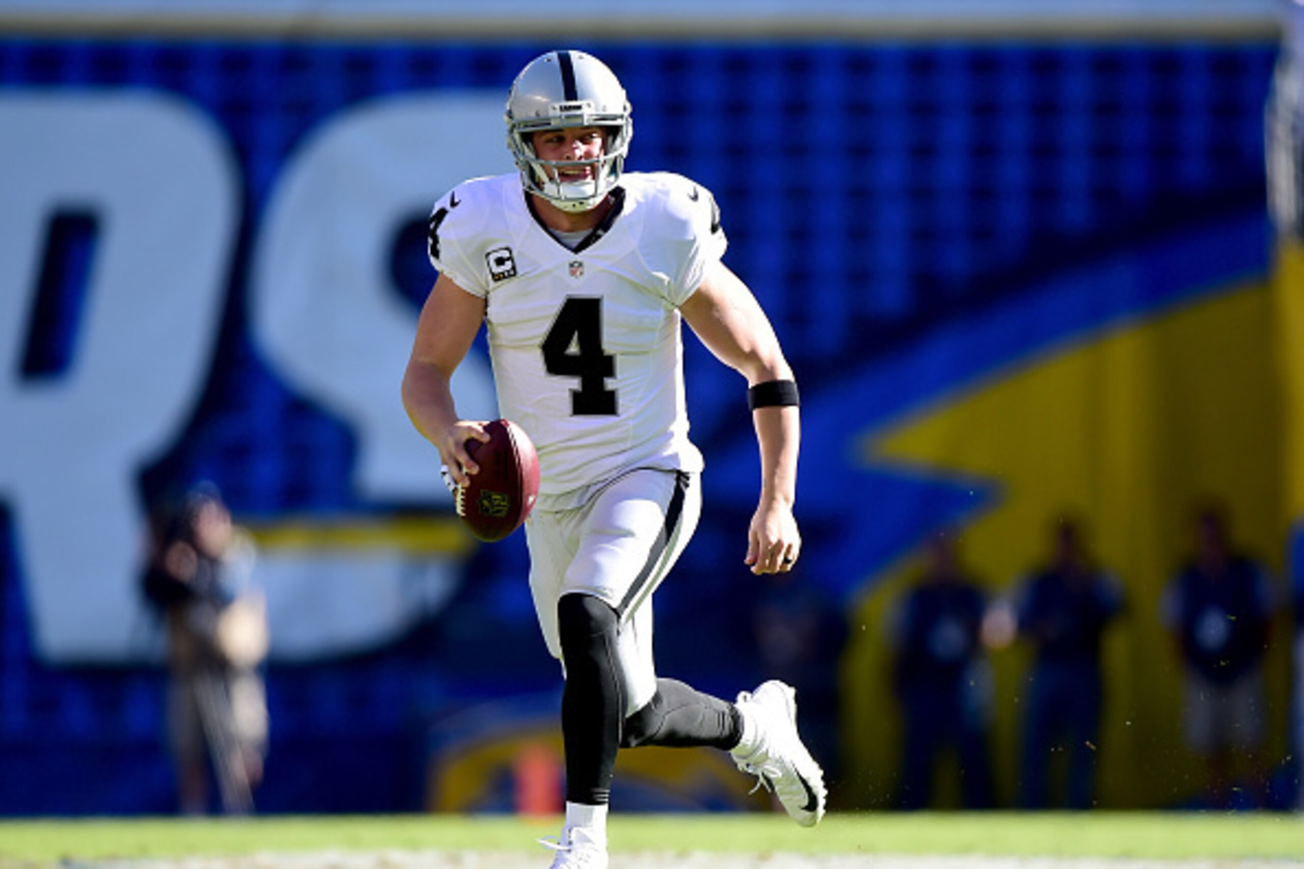 SAN DIEGO, CA - DECEMBER 18: Derek Carr #4 of the Oakland Raiders scrambles out of the pocket for a first down during the first quarter against the San Diego Chargers at Qualcomm Stadium on December 18, 2016 in San Diego, California. (Photo by Harry How SAN DIEGO, CA - DECEMBER 18: Derek Carr #4 of the Oakland Raiders scrambles out of the pocket for a first down during the first quarter against the San Diego Chargers at Qualcomm Stadium on December 18, 2016 in San Diego, California. (Photo by Harry How