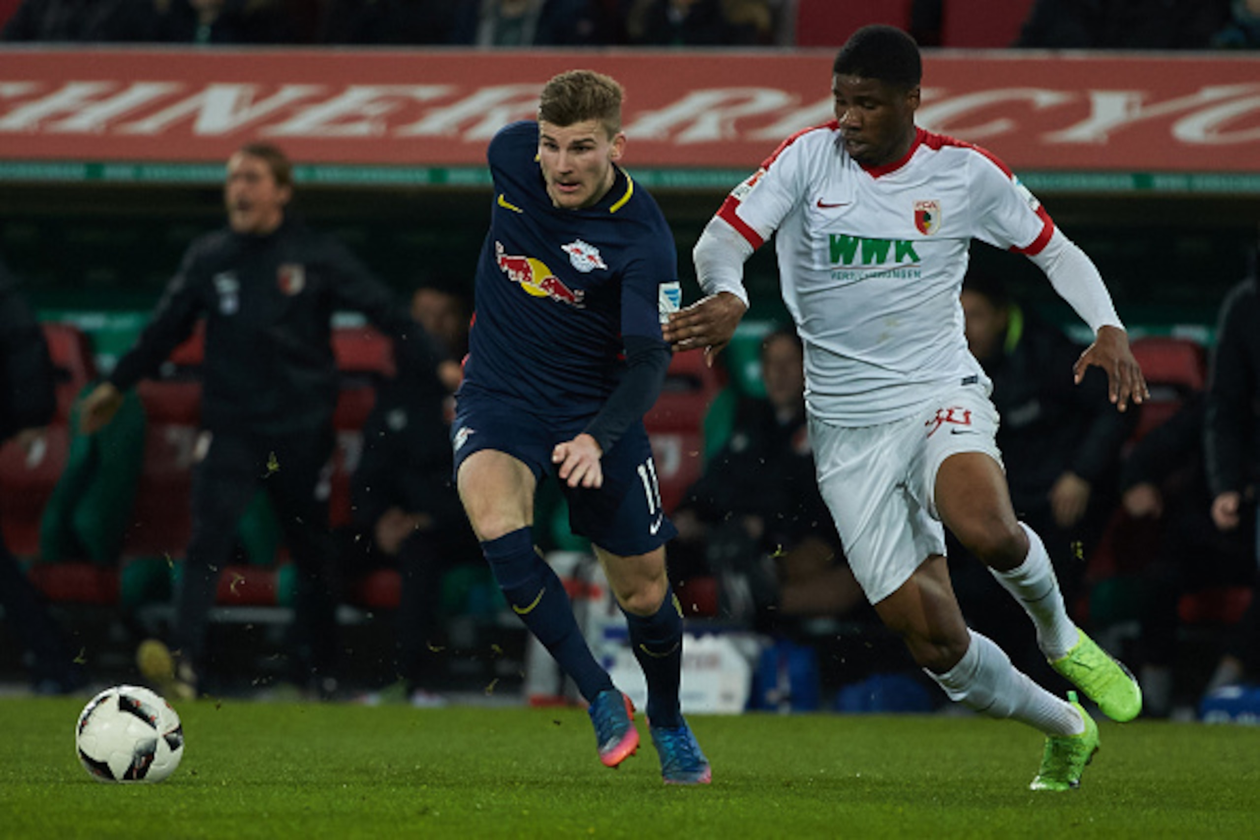 AUGSBURG, GERMANY - MARCH 03: Timo Werner of Leipzig and Kevin Danso of Augsburg battle for the ball during the Bundesliga match between FC Augsburg and RB Leipzig at WWK Arena on March 3, 2017 in Augsburg, Germany. (Photo by TF-Images/Getty Images)