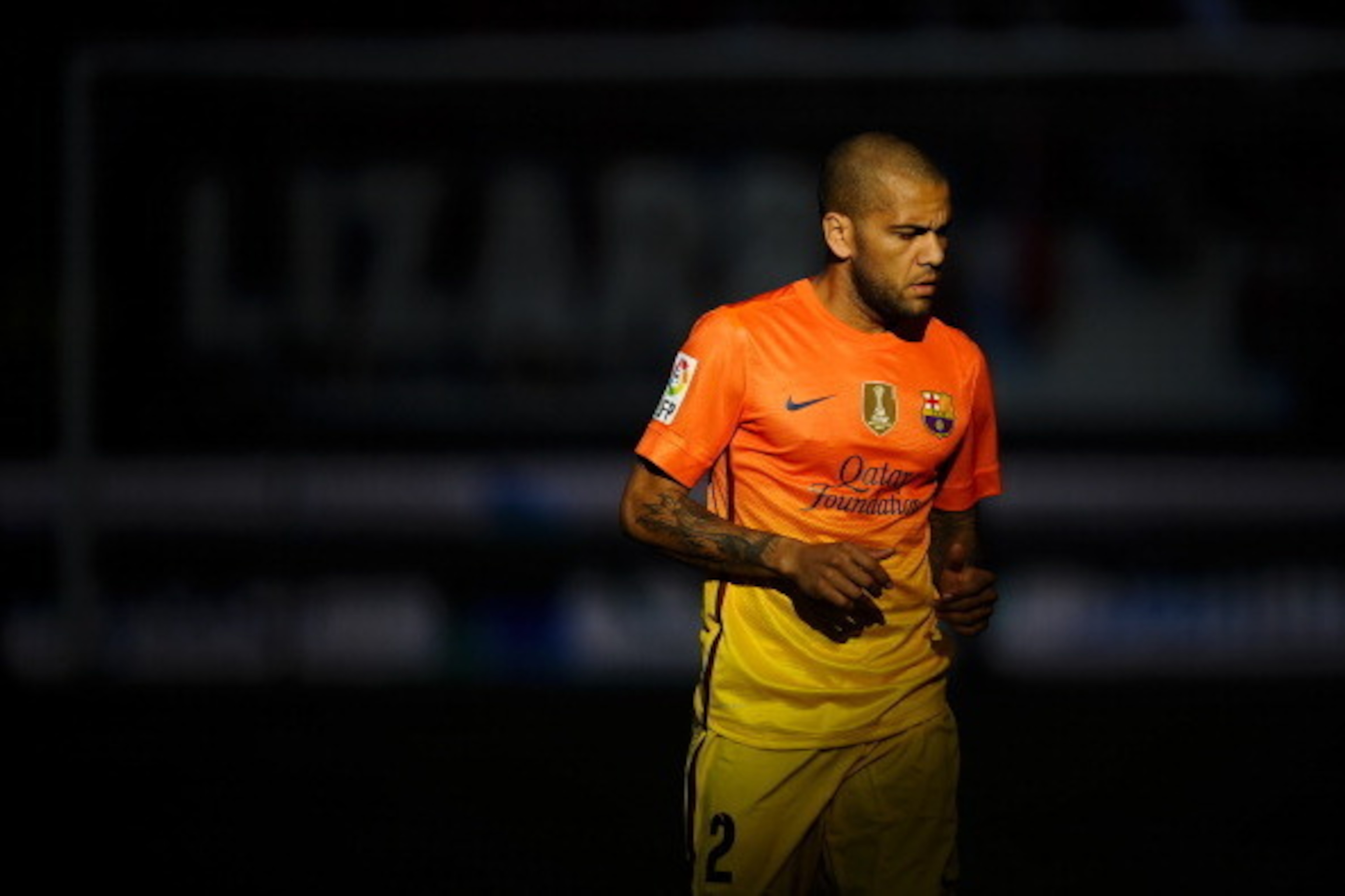 PAMPLONA, SPAIN - AUGUST 26: Dani Alves of FC Barcelona looks on during the La Liga match between CA Osasuna and FC Barcelona at Estadio Reyno de Navarra on August 26, 2012 in Pamplona, Spain. FC Barcelona won 1-2.  (Photo by David Ramos/Getty Images)