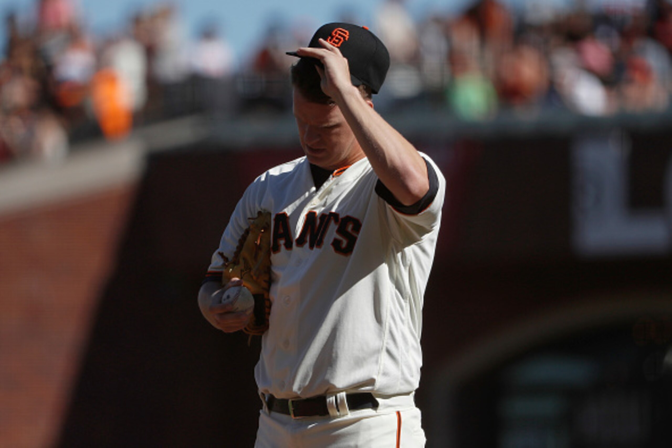 SAN FRANCISCO, CA - SEPTEMBER 18: Relief pitcher Matt Cain #18 of the San Francisco Giants adjusts his hat during the ninth inning against the St. Louis Cardinals at AT&T Park on September 18, 2016 in San Francisco, California. The Cardinals defeated the 