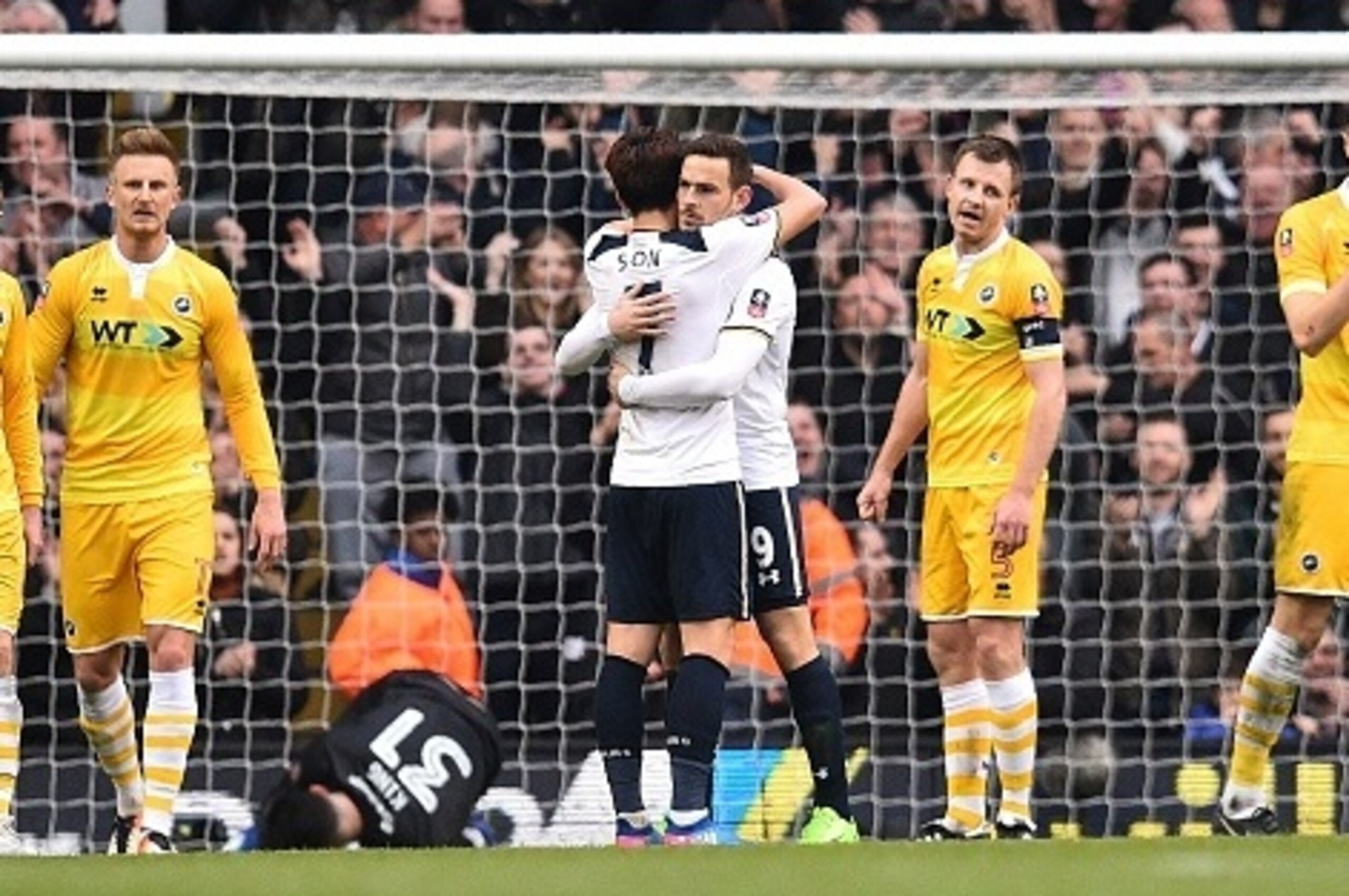 Tottenham Hotspur's Dutch striker Vincent Janssen (centre R) celebrates scoring his team's fifth goal with Tottenham Hotspur's South Korean striker Son Heung-Min during the English FA Cup quarter-final football match between Tottenham Hotspur and Millwall
