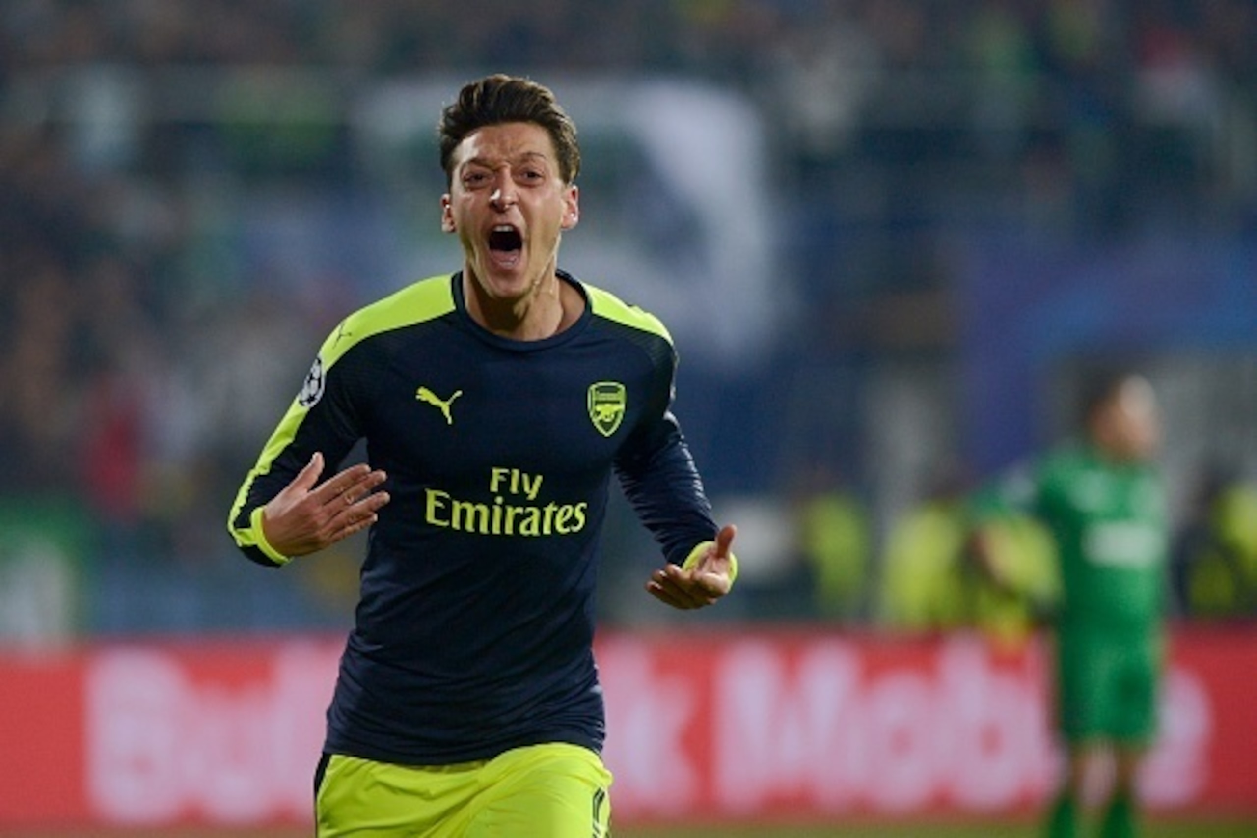 Arsenals German midfielder Mesut Ozil celebrates after scoring a goal during the UEFA Champions League Group A football match between PFC Ludogorets and Arsenal, on November 1, 2016 at the Vassil Levski stadium in Sofia.  / AFP / NIKOLAY DOYCHINOV        