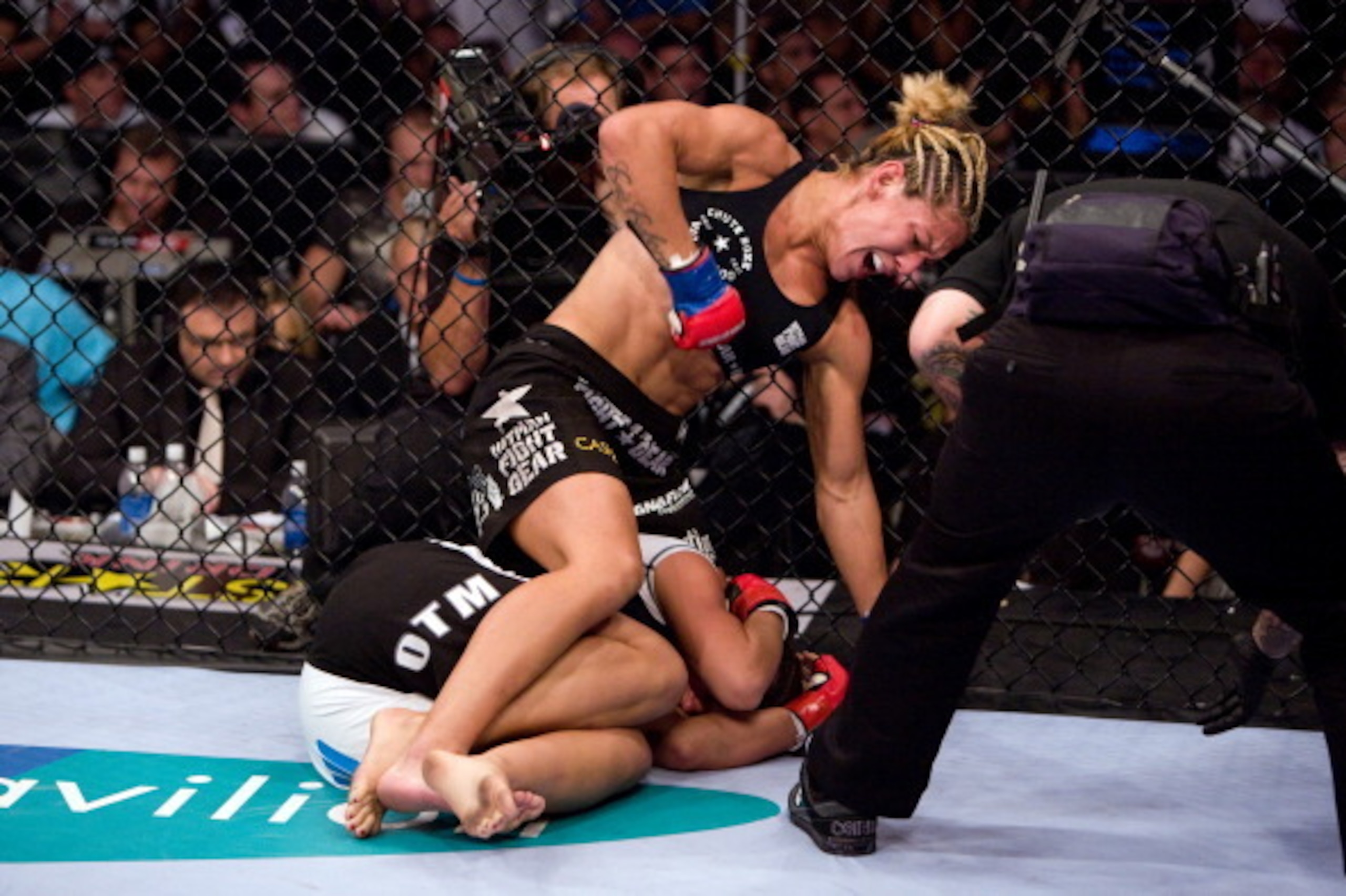 SAN JOSE, CA - AUGUST 15:  (L-R) Cristiane 'Cyborg' Santos punches Gina Carano during the inaugural Strikeforce Women's Championship event at HP Pavilion on August 15, 2009 in San Jose, California. (Photo by Esther Lin/Forza LLC/Forza LLC via Getty Images