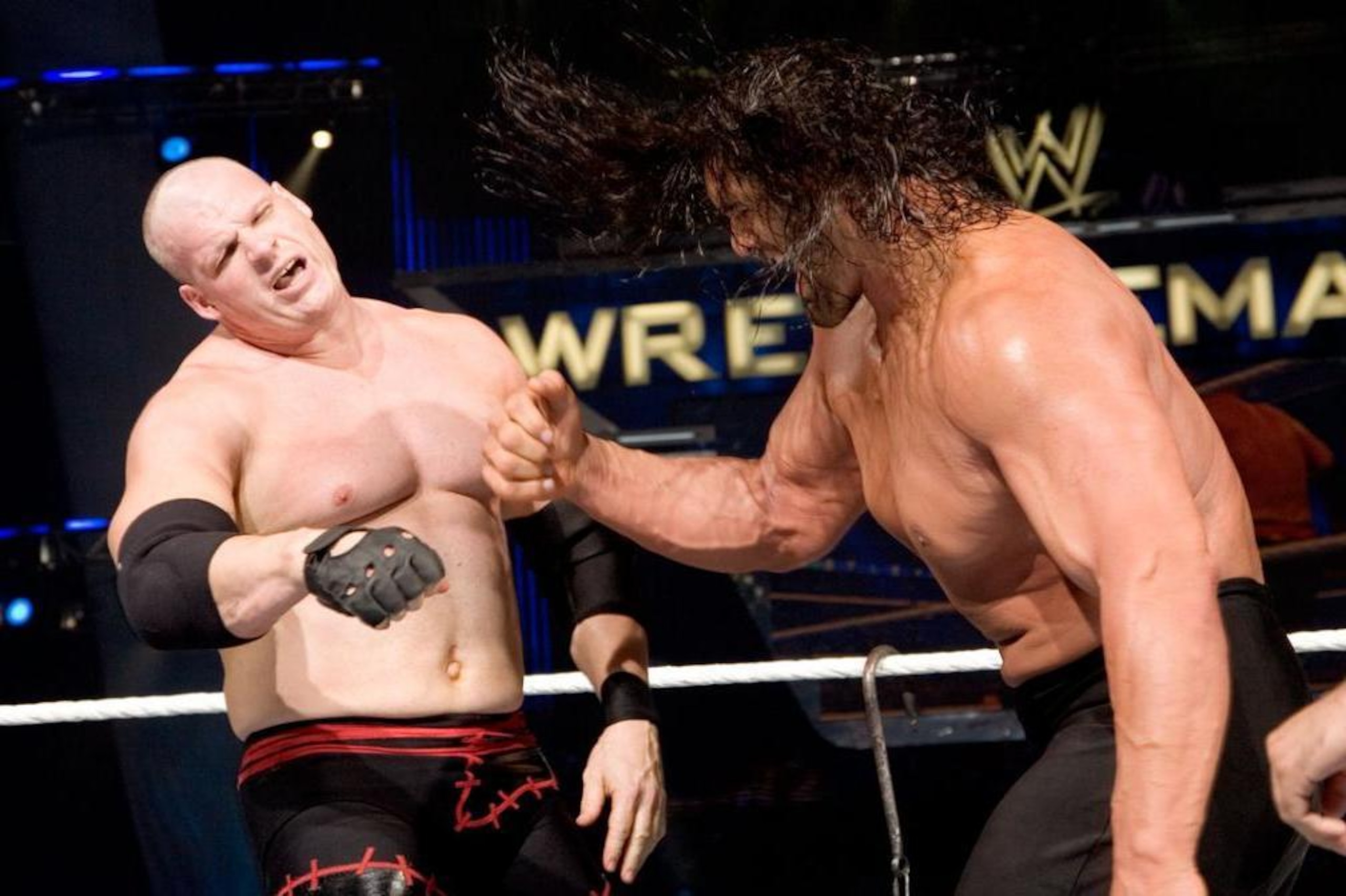 The Great Khali on the attack against Kane.