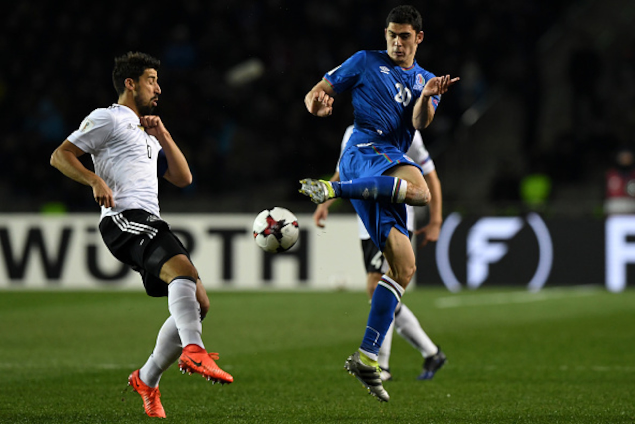 Germany's Sami Khedira (L) and Azerbaijan's Ramil Sheydaev vie for the ball during the FIFA World Cup 2018 qualification football match between Azerbaijan and Germany in Baku on March 26, 2017. / AFP PHOTO / Kirill KUDRYAVTSEV        (Photo credit should 