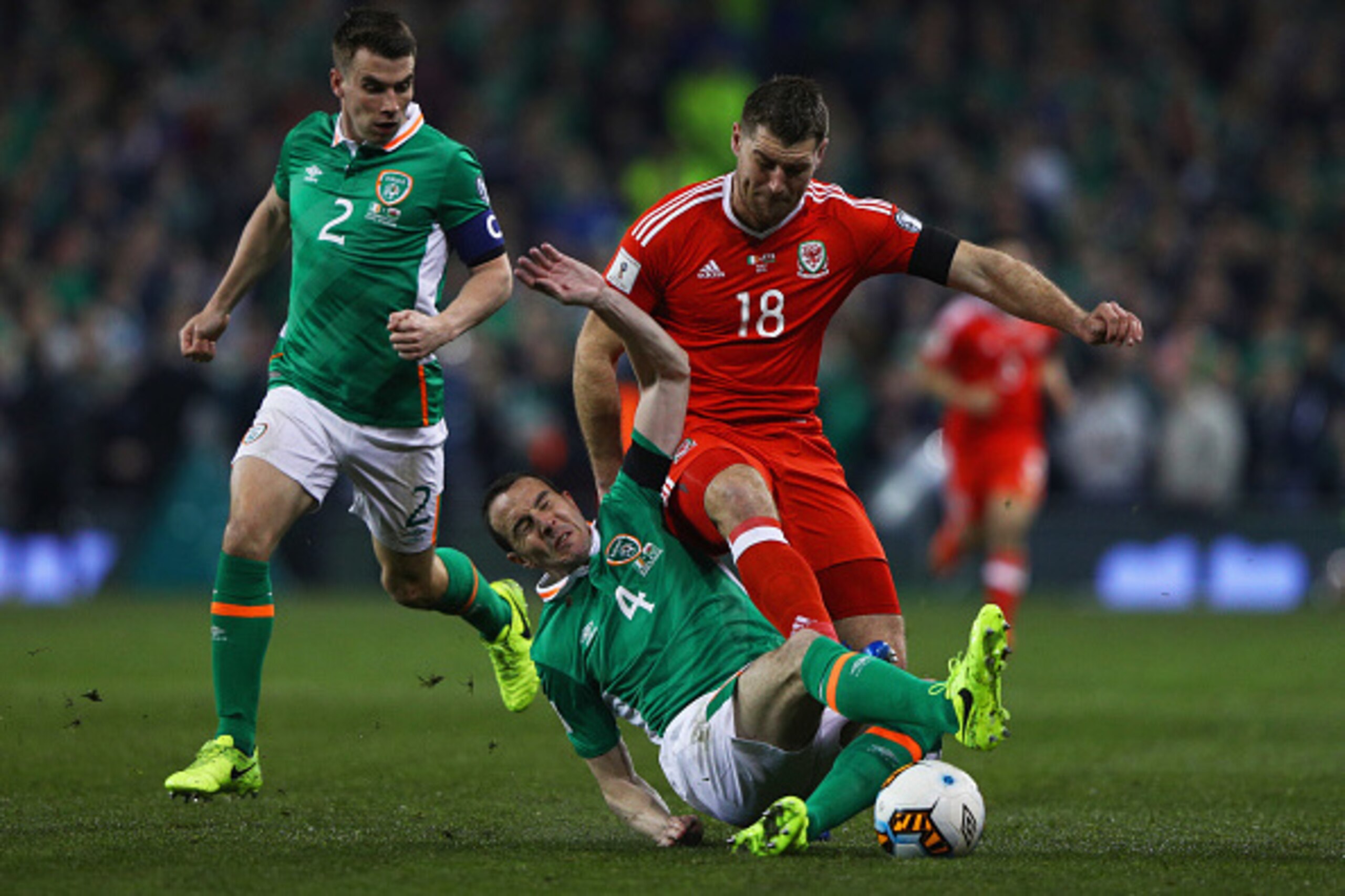 DUBLIN, IRELAND - MARCH 24:  Sam Vokes of Wales battles with John O'Shea (4) and Seamus Coleman of the Republic of Ireland (2) during the FIFA 2018 World Cup Qualifier between Republic of Ireland and Wales at Aviva Stadium on March 24, 2017 in Dublin, Ire