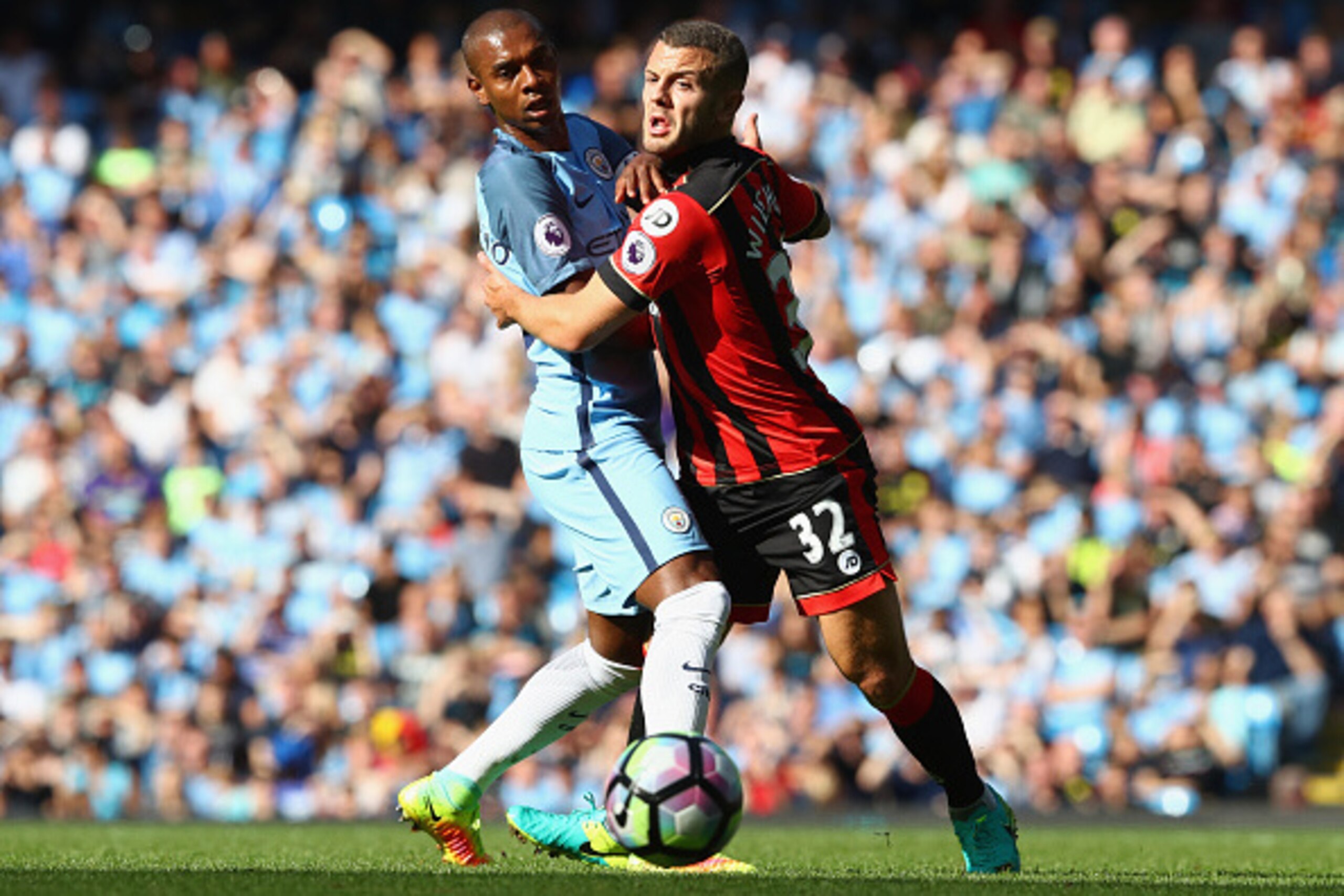 MANCHESTER, ENGLAND - SEPTEMBER 17:  Fernandinho of Manchester CFernandinho of Manchester City(L) and Jack Wilshere of AFC BournemoJack Wilshere of AFC Bournemouth(R) battle for possession  during the Premier League match between Manchester City and AFC B