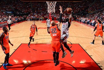 HOUSTON, TX - MARCH 26: James Harden #13 of the Houston Rockets goes up for the layup against the Oklahoma City Thunder on March 26, 2017 at the Toyota Center in Houston, Texas. NOTE TO USER: User expressly acknowledges and agrees that, by downloading and