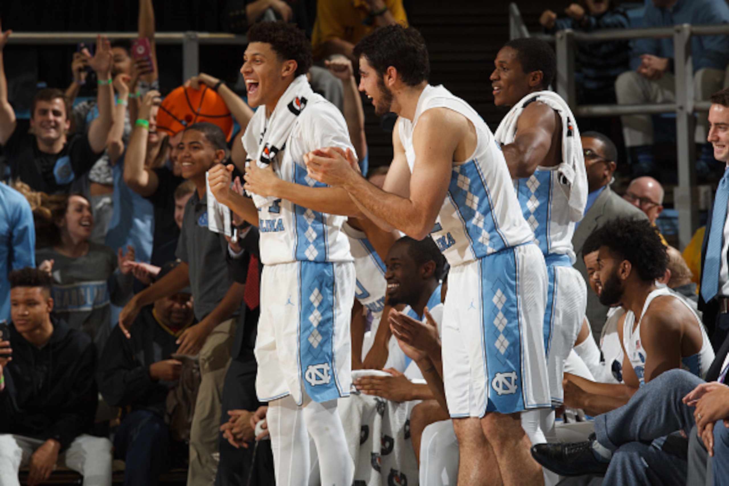 CHAPEL HILL, NC - DECEMBER 28: Justin Jackson #44 and Luke Maye #32 of the North Carolina Tar Heels cheer from the bench during a game against the Monmouth Hawks on December 28, 2016 at the Dean Smith Center in Chapel Hill, North Carolina. North Carolina CHAPEL HILL, NC - DECEMBER 28: Justin Jackson #44 and Luke Maye #32 of the North Carolina Tar Heels cheer from the bench during a game against the Monmouth Hawks on December 28, 2016 at the Dean Smith Center in Chapel Hill, North Carolina. North Carolina