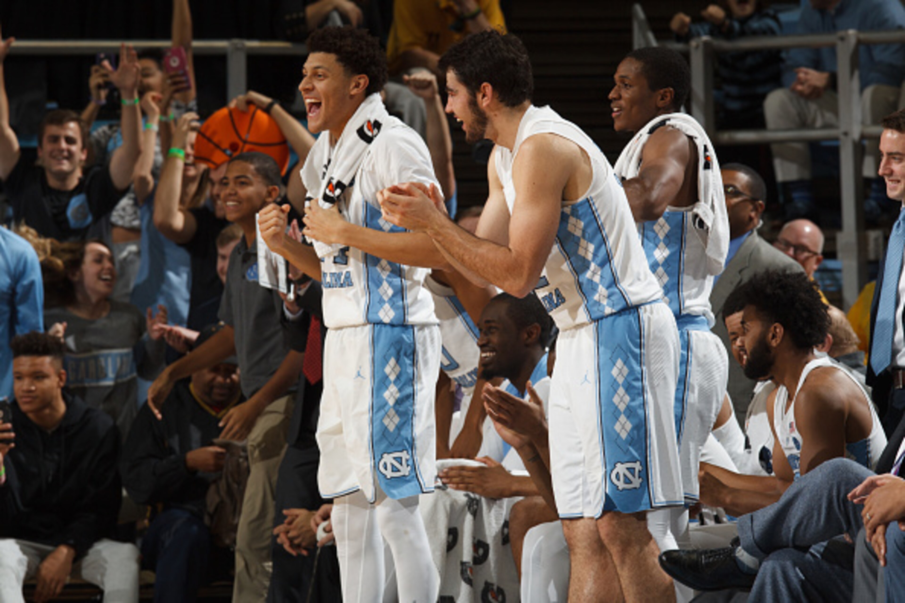 CHAPEL HILL, NC - DECEMBER 28: Justin Jackson #44 and Luke Maye #32 of the North Carolina Tar Heels cheer from the bench during a game against the Monmouth Hawks on December 28, 2016 at the Dean Smith Center in Chapel Hill, North Carolina. North Carolina 