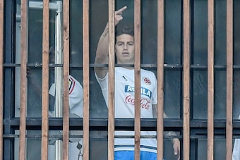 Colombia's midfielder James Rodriguez gestures toward the journalists before a training session at the Colombian football Federation in Bogota on March 25 2017 ahead of their FIFA World Cup South American qualifier football match against Ecuador. / AFP PH