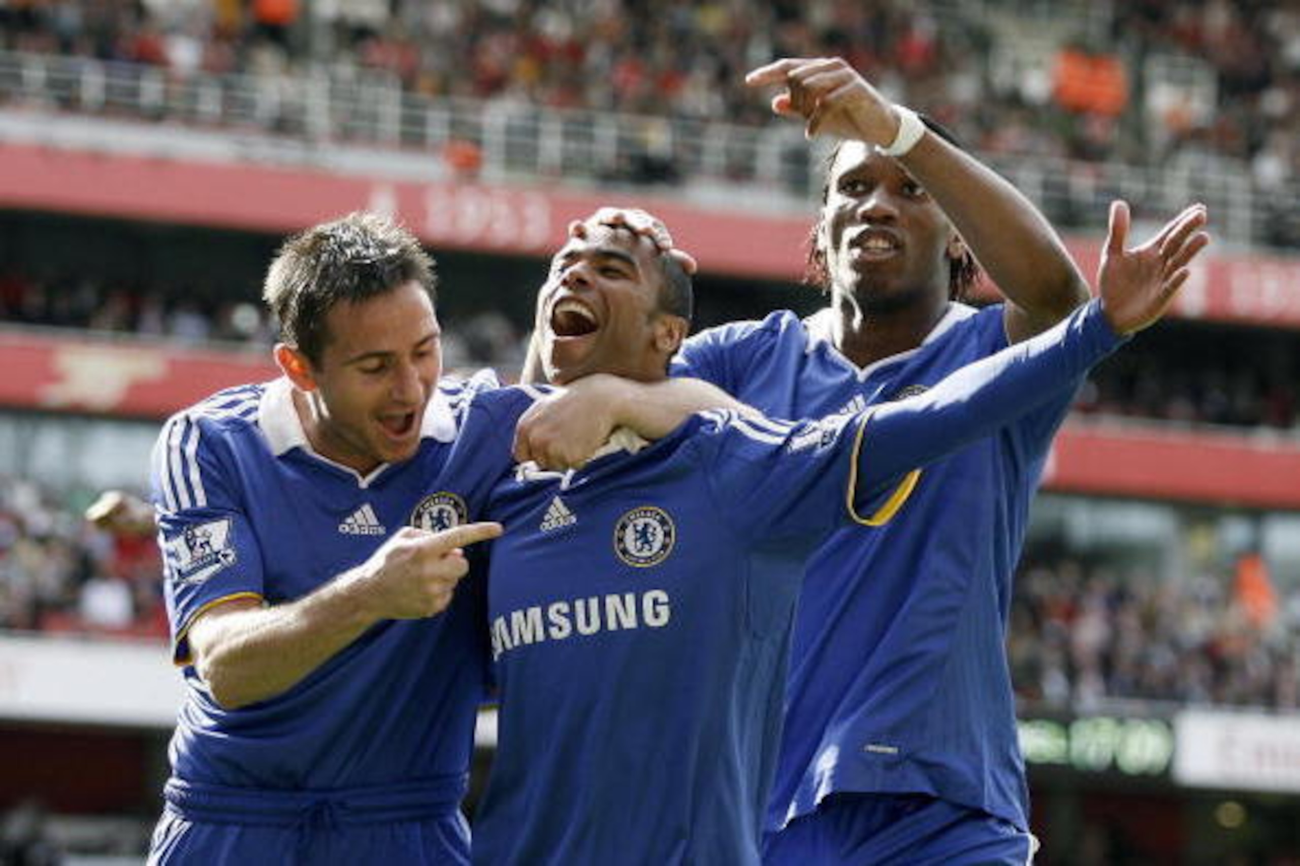 Chelsea's Ashley Cole (C), Chelsea's Frank Lampard (L) and Chelsea's Ivory Coast footballer Didier Drogba celebrates the own goal by Arsenal's Ivory Coast player Kolo Toure (not pictured) during their Premiership football match at The Emirates Stadium in Chelsea's Ashley Cole (C), Chelsea's Frank Lampard (L) and Chelsea's Ivory Coast footballer Didier Drogba celebrates the own goal by Arsenal's Ivory Coast player Kolo Toure (not pictured) during their Premiership football match at The Emirates Stadium in