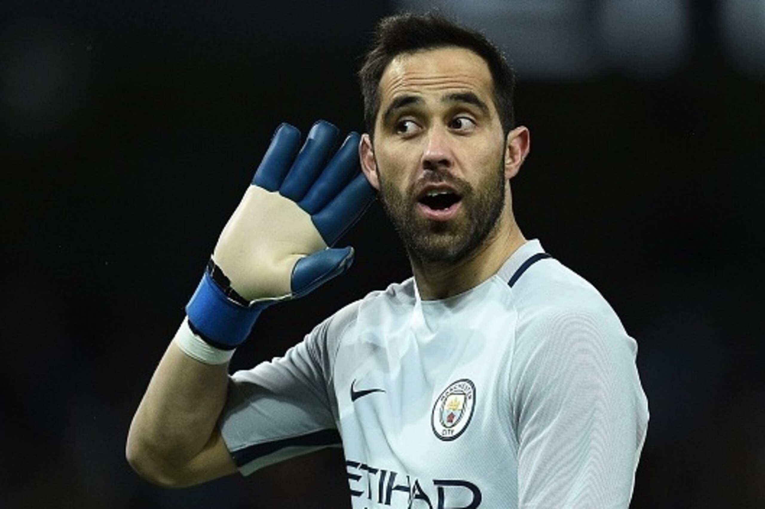 Manchester City's Chilean goalkeeper Claudio Bravo gestures to the Huddersfield fans after Manchester City's Nigerian striker Kelechi Iheanacho scored his team's fifth goal during the FA Cup fifth round replay football match between Manchester City and Hu