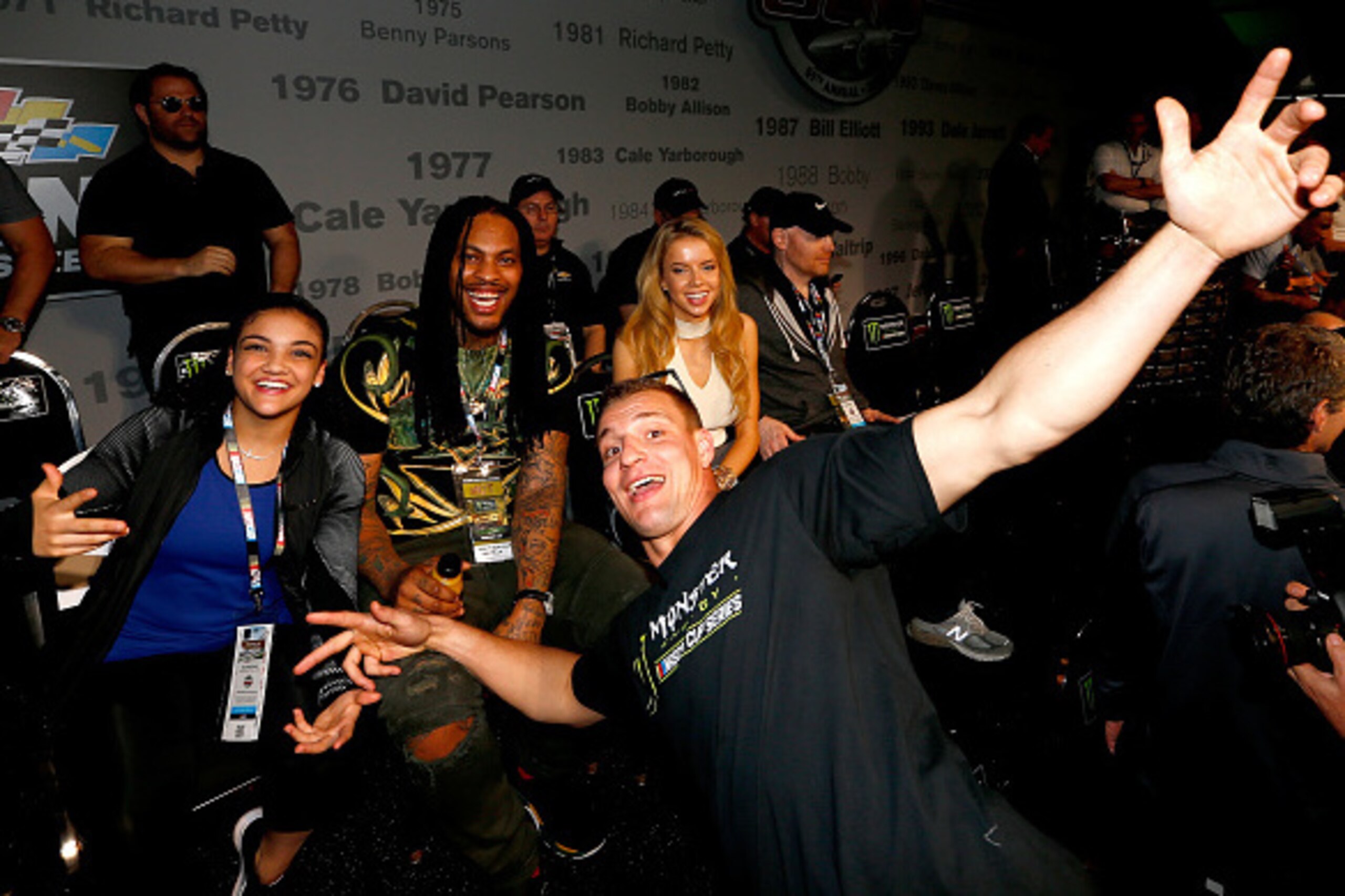 DAYTONA BEACH, FL - FEBRUARY 26:  (L-R) US Olympic gold medalist Laurie Hernandez, rapper Waka Flocka Flame and New England Patriots tight end Rob Gronkowski pose prior to the 59th Annual DAYTONA 500 at Daytona International Speedway on February 26, 2017 