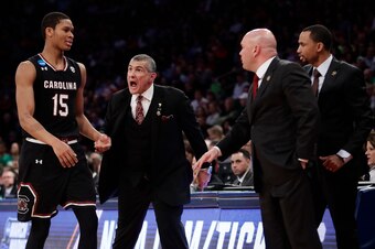 South Carolina head coach Frank Martin (second from left) reacts as Dozier comes off the floor on March 24, 2017.