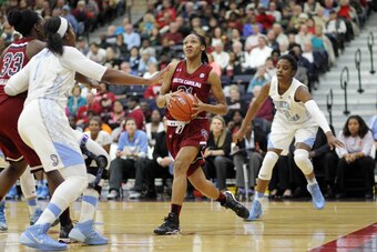 South Carolina's Asia Dozier drives to the basket against North Carolina on December 18, 2013.