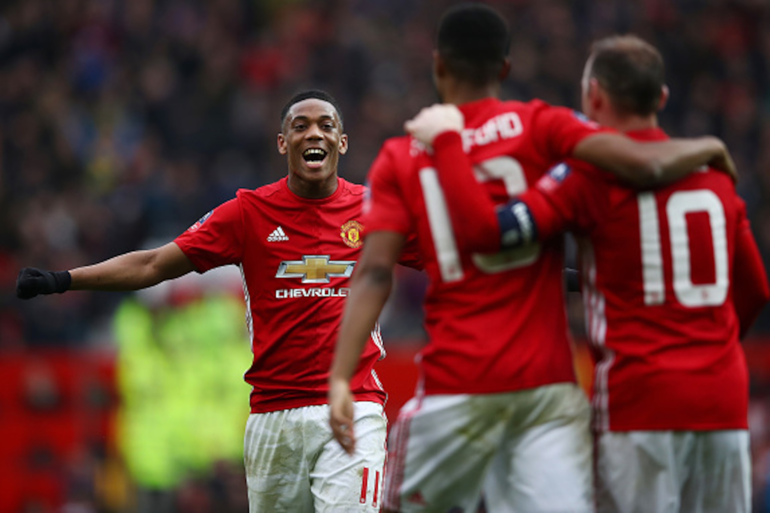 MANCHESTER, ENGLAND - JANUARY 07:  Marcus Rashford of Manchester United celebrates with wayne Rooney and Anthony Martial of Manchester United after scoring his first and his sides third goal during the Emirates FA Cup third round match between Manchester 
