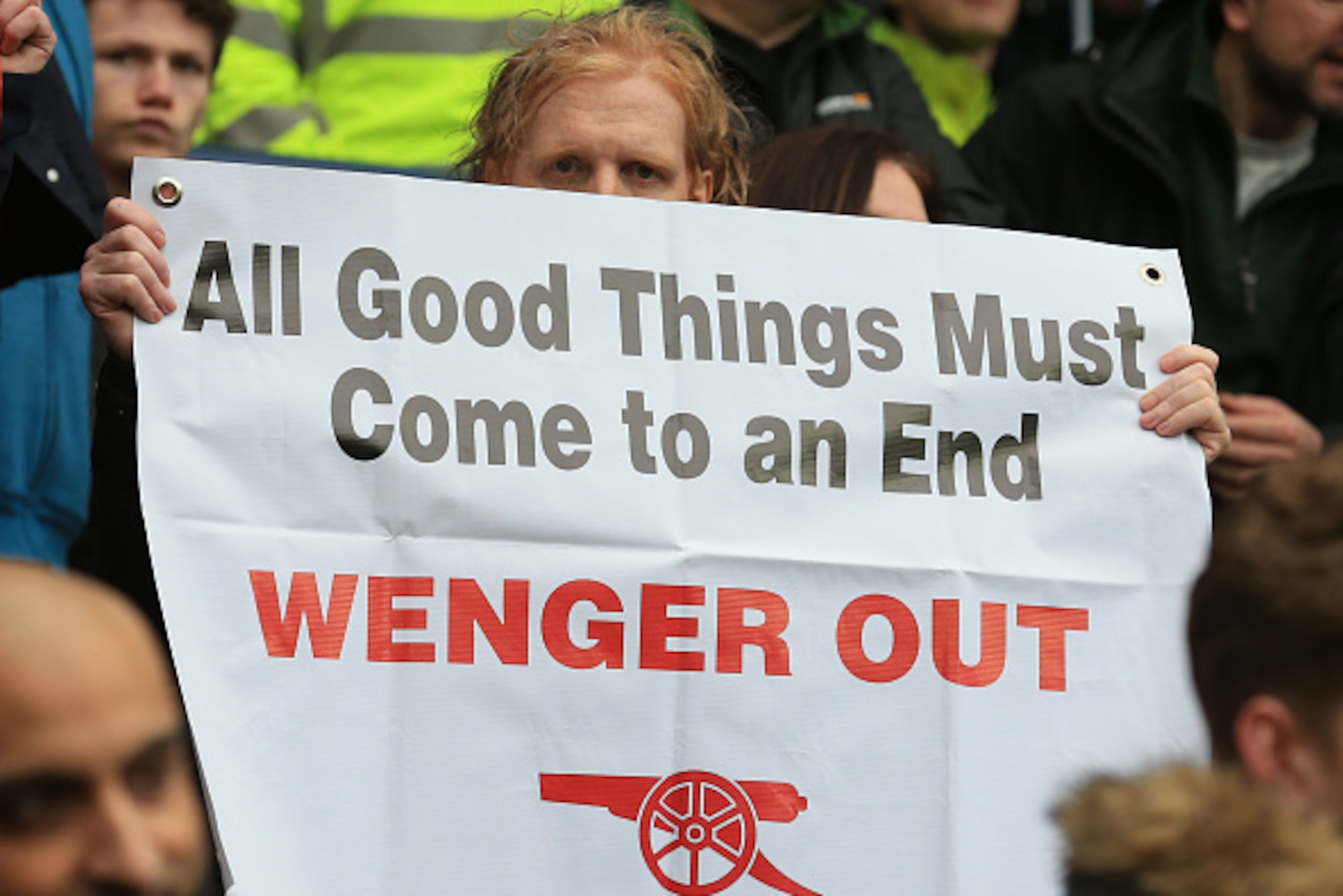 Arsenal fans hold up anti - Arsene Wenger signs after the English Premier League football match between West Bromwich Albion and Arsenal at The Hawthorns stadium in West Bromwich, central England, on March 18, 2017.
 / AFP PHOTO / Lindsey PARNABY / RESTRI