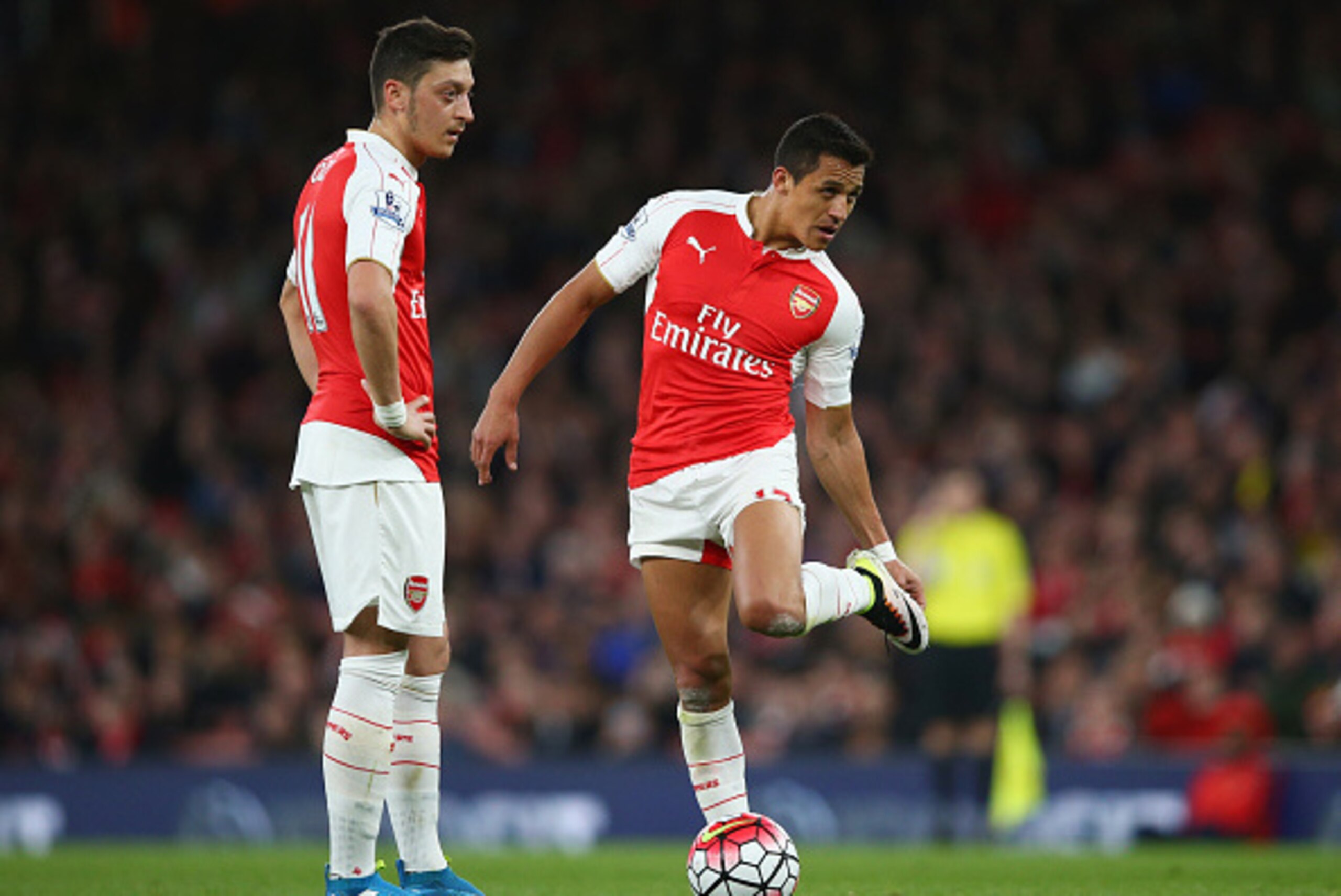 LONDON, ENGLAND - APRIL 21:  Mesut Ozil and Alexis Sanchez of Arsenal prepare to kick off during the Barclays Premier League match between Arsenal and West Bromwich Albion at the Emirates Stadium on April 21, 2016 in London, England.  (Photo by Paul Gilha