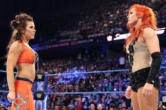 Mickie James stares down Becky Lynch.