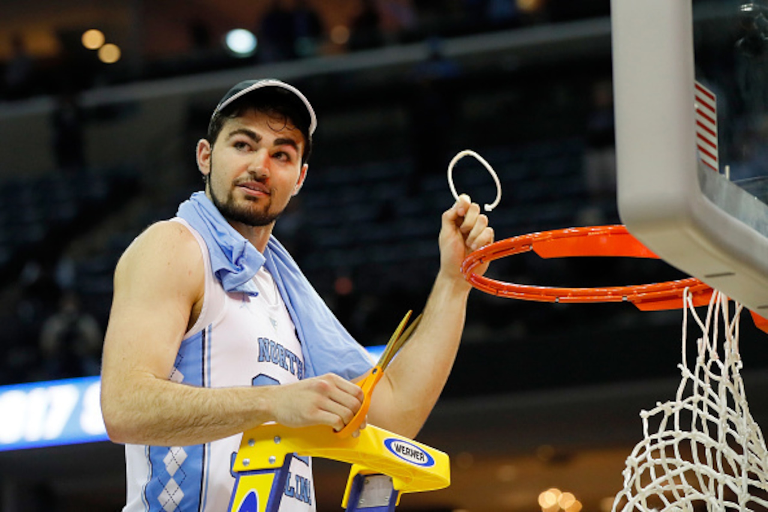 MEMPHIS, TN - MARCH 26:  Luke Maye #32 of the North Carolina Tar Heels cuts down the net after making the game winning shot and defeating the Kentucky Wildcats during the 2017 NCAA Men's Basketball Tournament South Regional at FedExForum on March 26, 2017