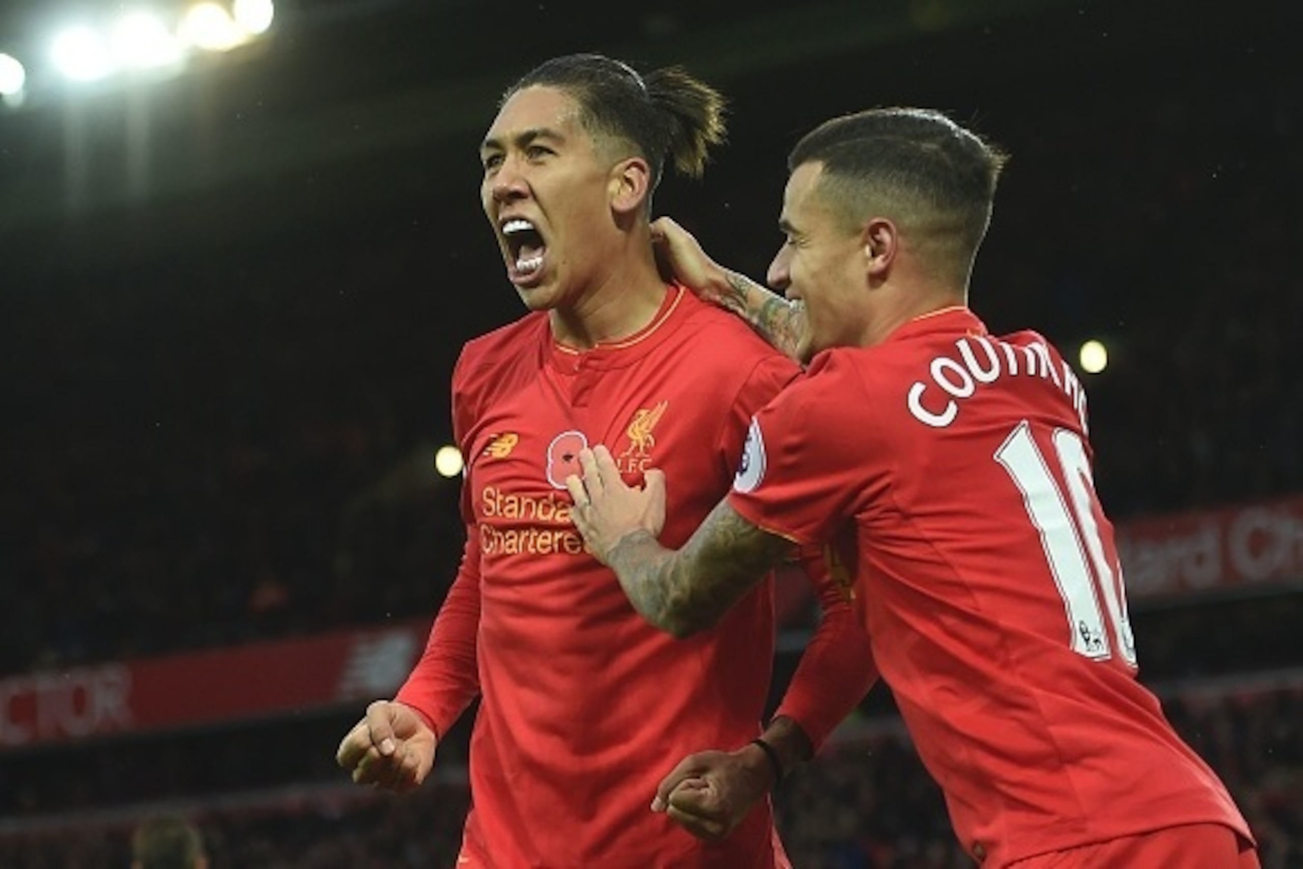 Liverpool's Brazilian midfielder Roberto Firmino (L) celebrates scoring his team's fourth goal with Liverpool's Brazilian midfielder Philippe Coutinho during the English Premier League football match between Liverpool and Watford at Anfield in Liverpool, Liverpool's Brazilian midfielder Roberto Firmino (L) celebrates scoring his team's fourth goal with Liverpool's Brazilian midfielder Philippe Coutinho during the English Premier League football match between Liverpool and Watford at Anfield in Liverpool,