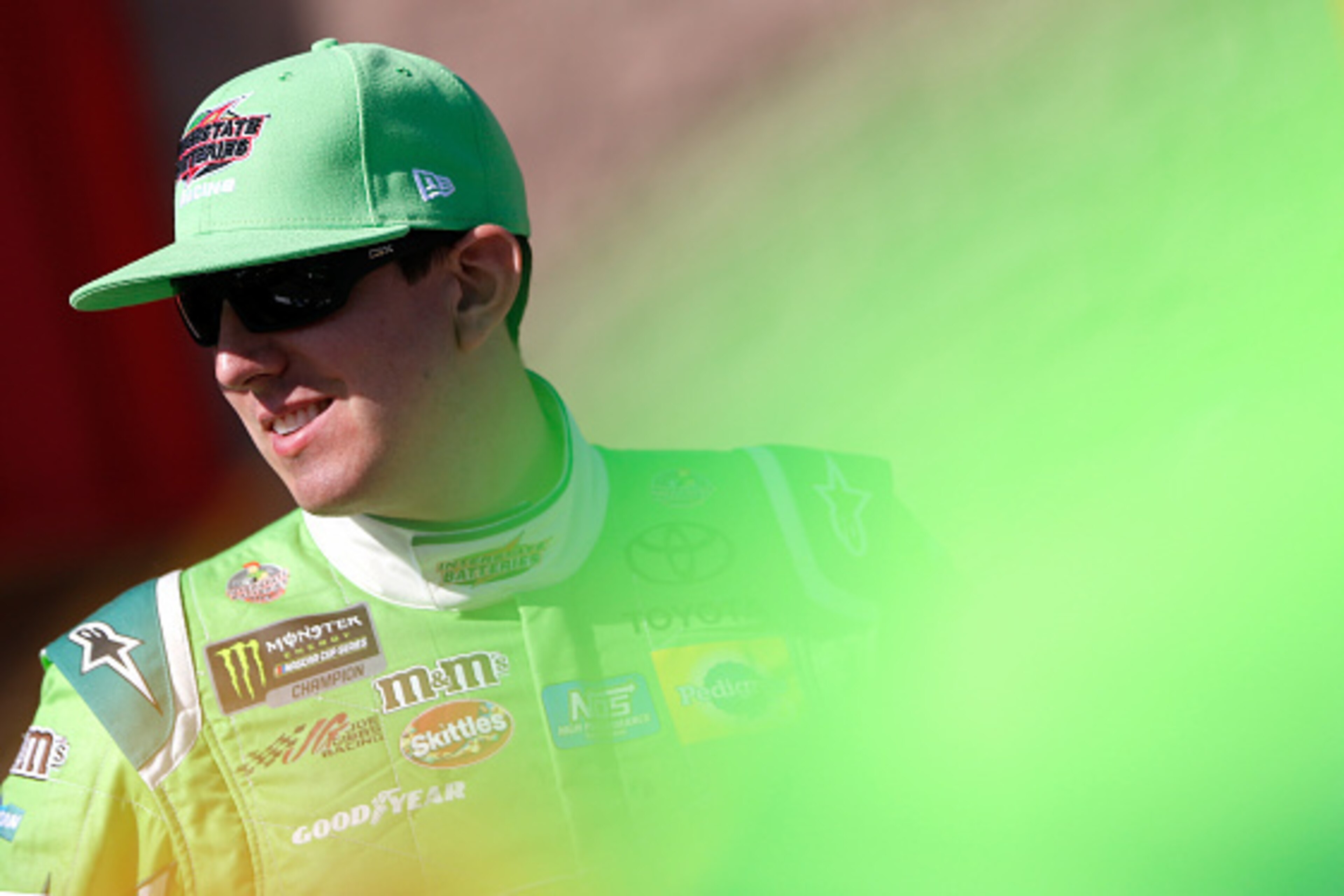 FONTANA, CA - MARCH 24:  Kyle Busch, driver of the #18 Interstate Batteries Toyota, stands by his car during qualifying for the Monster Energy NASCAR Cup Series Auto Club 400 at Auto Club Speedway on March 24, 2017 in Fontana, California.  (Photo by Brian