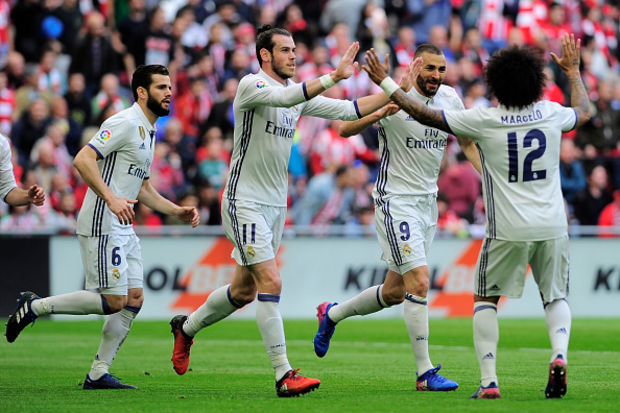 Real Madrid's players celebrate after French forward Karim Benzema (2R)scored their team's first goal during the Spanish league football match Athletic Club Bilbao vs Real Madrid CF at the San Mames stadium in Bilbao on March 18, 2017. / AFP PHOTO / ANDER Real Madrid's players celebrate after French forward Karim Benzema (2R)scored their team's first goal during the Spanish league football match Athletic Club Bilbao vs Real Madrid CF at the San Mames stadium in Bilbao on March 18, 2017. / AFP PHOTO / ANDER