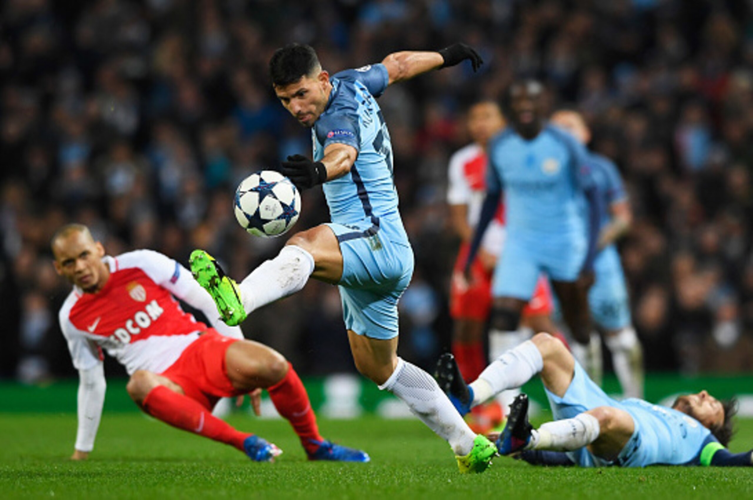 MANCHESTER, ENGLAND - FEBRUARY 21: Sergio Aguero of Manchester City beats Fabinho of AS Monaco during the UEFA Champions League Round of 16 first leg match between Manchester City FC and AS Monaco at Etihad Stadium on February 21, 2017 in Manchester, Uni MANCHESTER, ENGLAND - FEBRUARY 21: Sergio Aguero of Manchester City beats Fabinho of AS Monaco during the UEFA Champions League Round of 16 first leg match between Manchester City FC and AS Monaco at Etihad Stadium on February 21, 2017 in Manchester, Uni