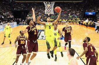 SACRAMENTO, CA - MARCH 17:  Tyler Dorsey #5 of the Oregon Ducks drives to the basket against E.J. Crawford #2 of the Iona Gaels in the first half during the first round of the 2017 NCAA Men's Basketball Tournament at Golden 1 Center on March 17, 2017 in S