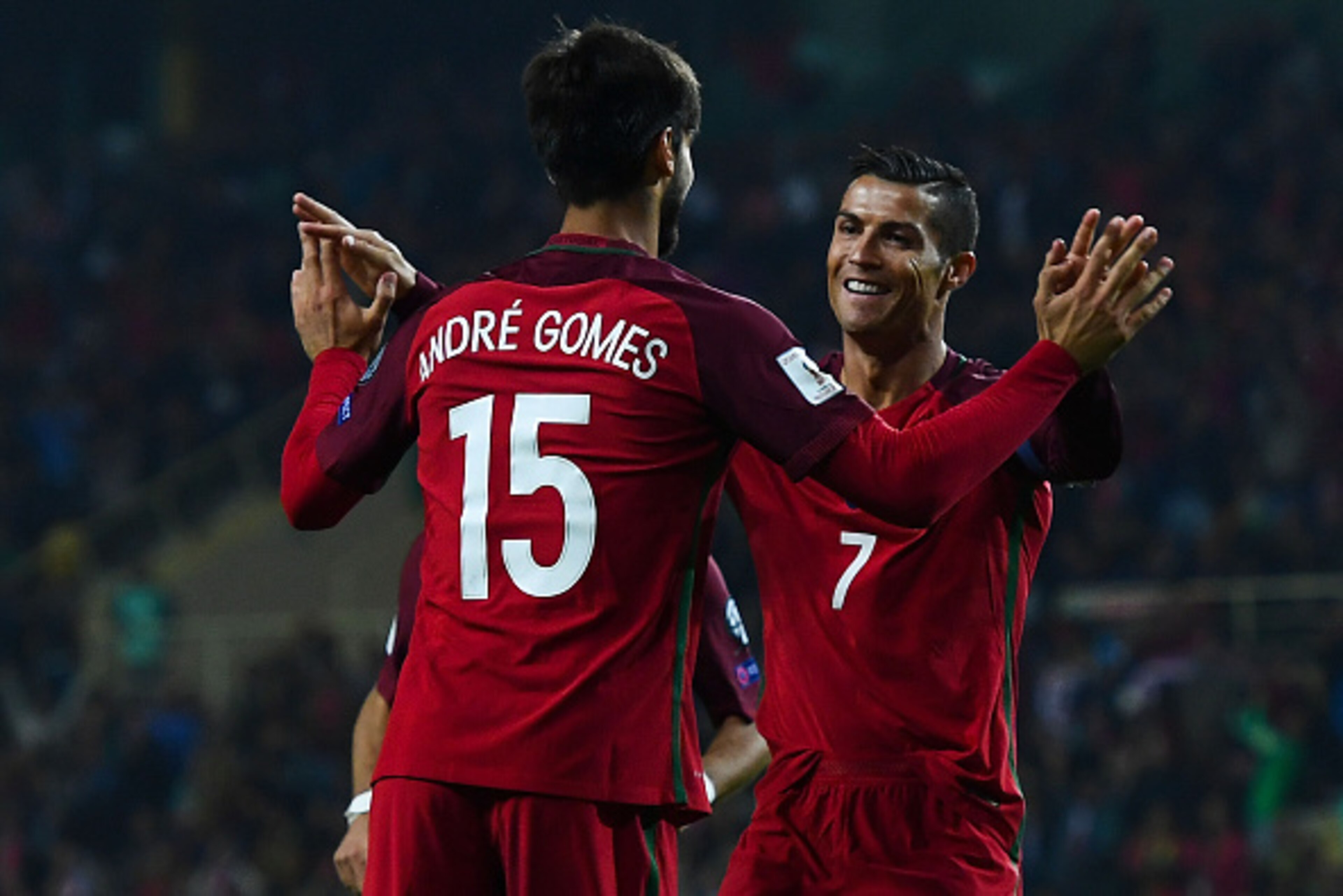 AVEIRO, PORTUGAL - OCTOBER 07:  Cristiano Ronaldo of Portugal celebrates with his team mate Andre Gomes  after scoring his team's fourth goal during the FIFA 2018 World Cup Qualifier between Portugal and Andorra at Estadio Municipal de Aveiro on October 7
