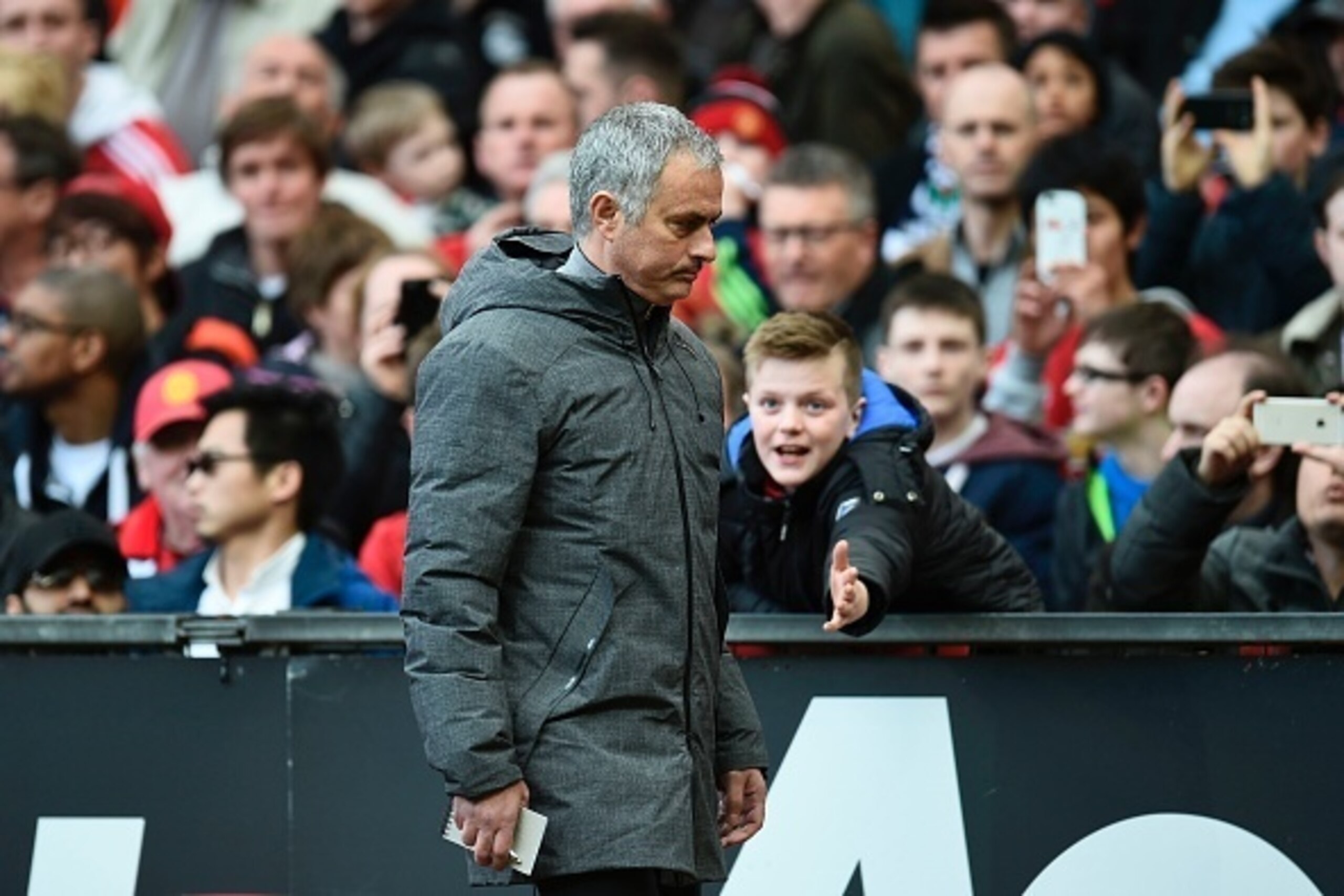 Manchester United's Portuguese manager Jose Mourinho leave the pitch at half-time during the English Premier League football match between Manchester United and West Bromwich Albion at Old Trafford in Manchester, north west England, on April 1, 2017. / AF