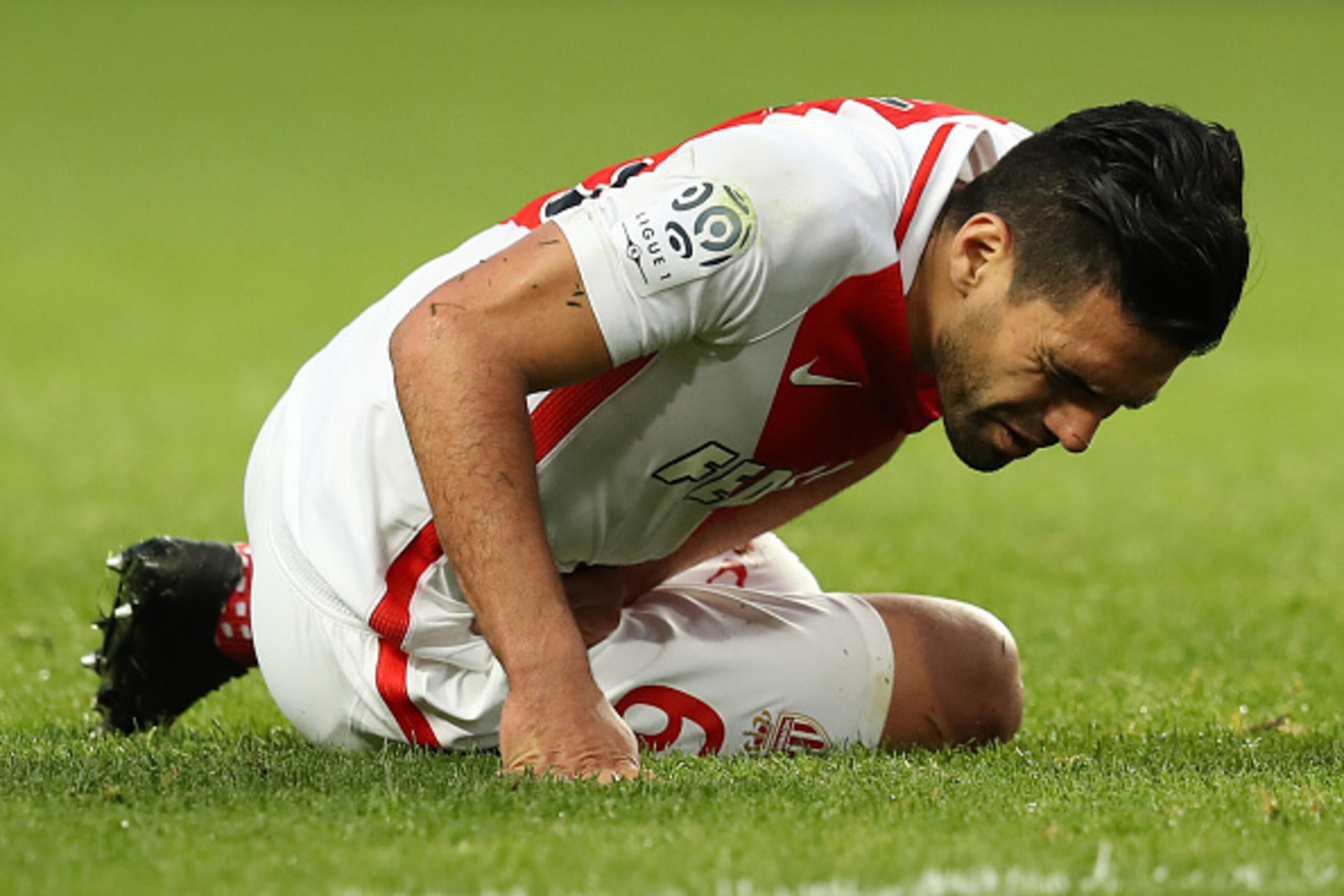 Monaco's Colombian forward Radamel Falcao grimaces in pain after falling during the French L1 football match Monaco (ASM) vs Bordeaux (GB) on March 11, 2017 at the Louis II Stadium in Monaco. / AFP PHOTO / VALERY HACHE        (Photo credit should read VAL