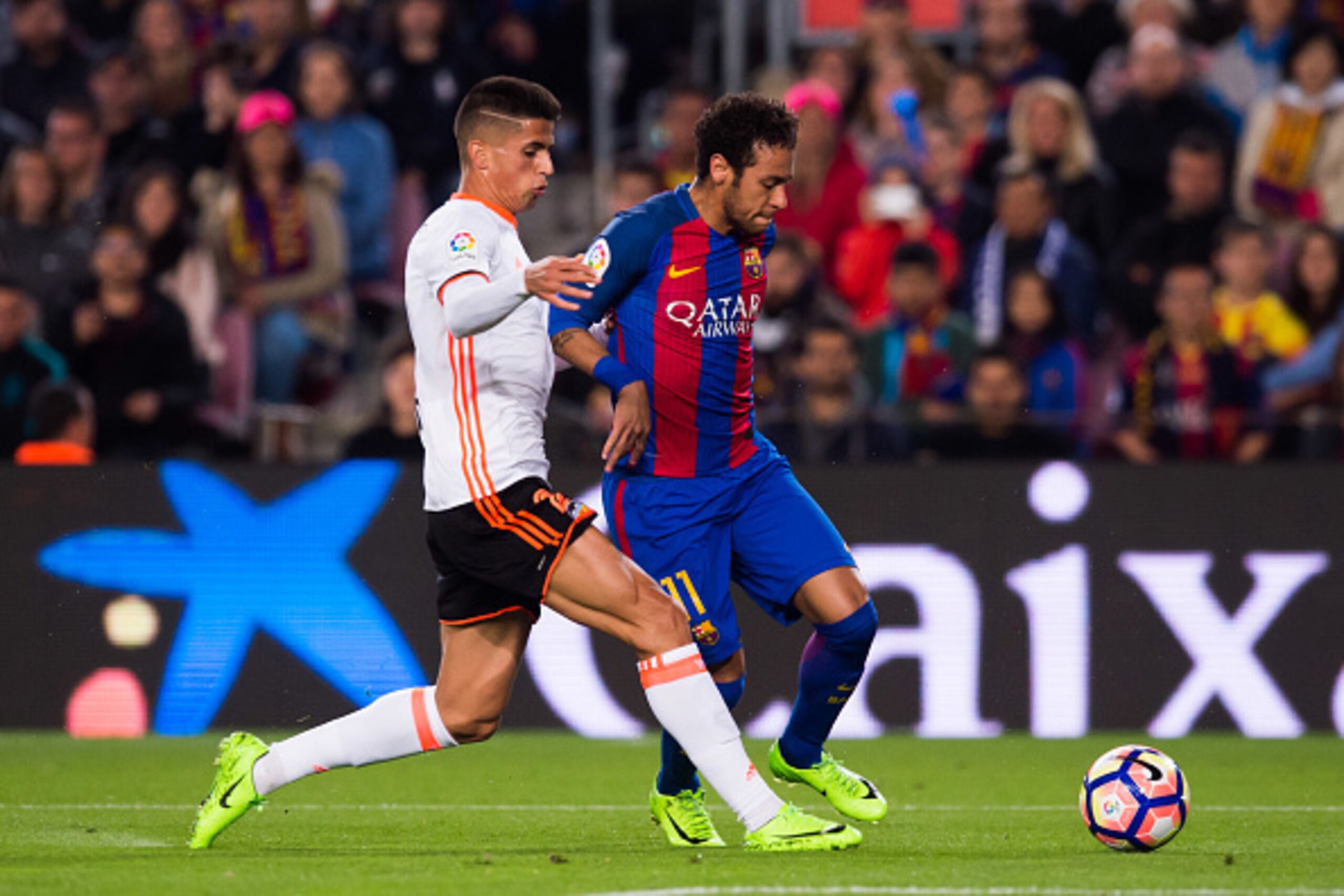 BARCELONA, SPAIN - MARCH 19:  Neymar Santos Jr (R) of FC Barcelona competes for the ball with Joao Cancelo (L) of Valencia CF during the La Liga match between FC Barcelona and Valencia CF at Camp Nou stadium on March 19, 2017 in Barcelona, Spain.  (Photo 